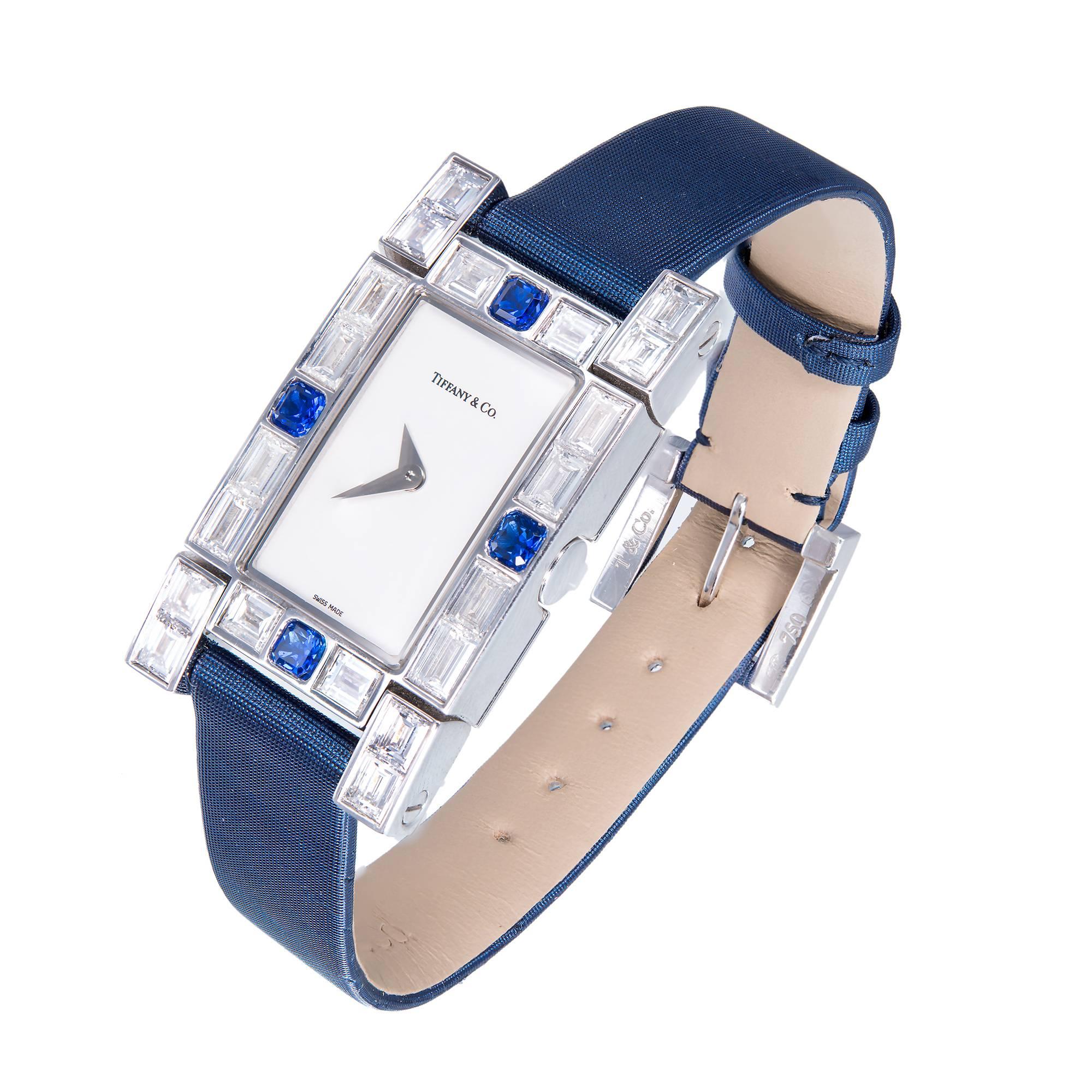 Lucida Collection diamond and sapphire 18k white gold wristwatch. White gold and diamond buckle. Fine bright blue sapphires, fine white diamonds. Blue Tiffany band. Original box included.

30 emerald and baguette cut diamonds 5ct total weight  F