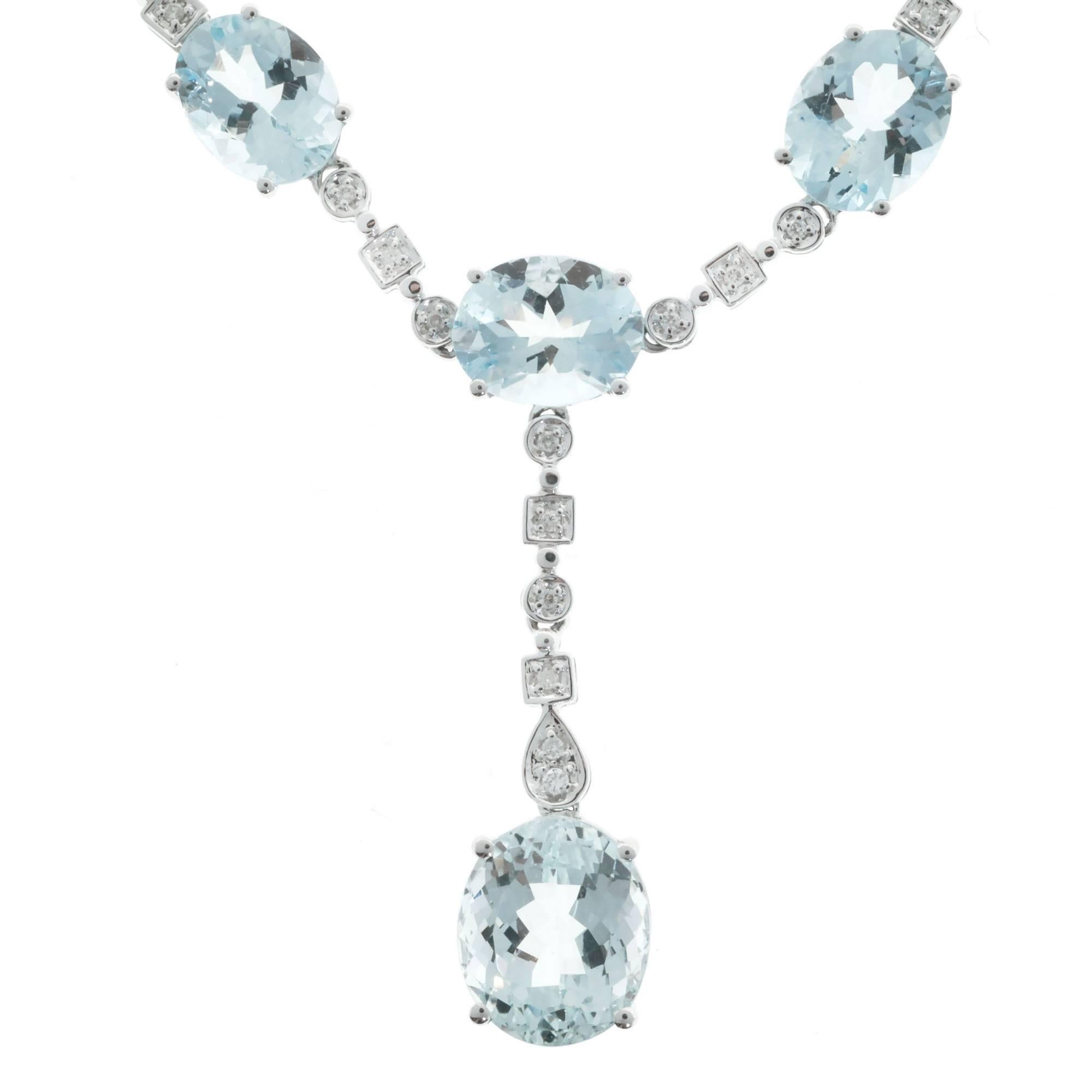 Dramatic “Y” style necklace with over 20.00cts of natural bright light blue Aqua in 18k white gold with diamond accents.

10 oval bright light greenish blue natural Aquamarines, approx. total weight 22.25cts, VS
30 round diamonds, approx. total