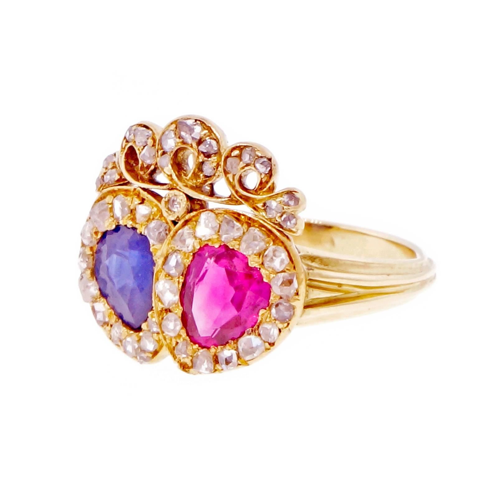 Victorian sapphire, ruby and diamond crown ring. circa 1870. GIA certified pear shaped Burman natural no heat ruby and cornflower sapphire set an 18k yellow gold crown setting with a halo of 42 rose cut diamonds. A truly unique and rare gem from the