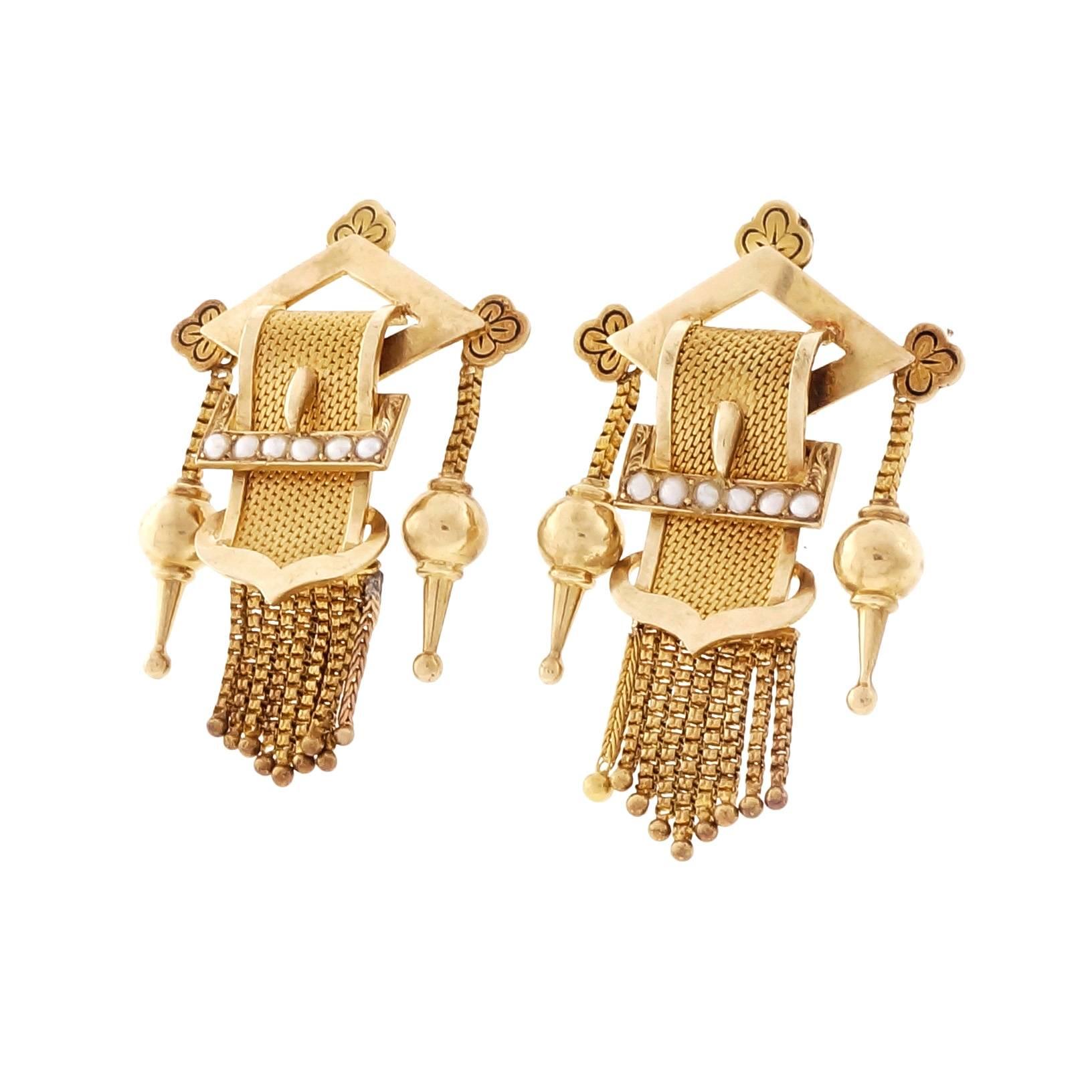 Victorian 1880 18k yellow gold tassel buckle natural pearl 18k yellow gold pierced post earrings. Natural patina.

12 natural half pearls 2mm
18k yellow gold
Tested: 18k
Stamped: 750
12.6 grams
Top to bottom: 39.68mm or 1.56 inches
Width: