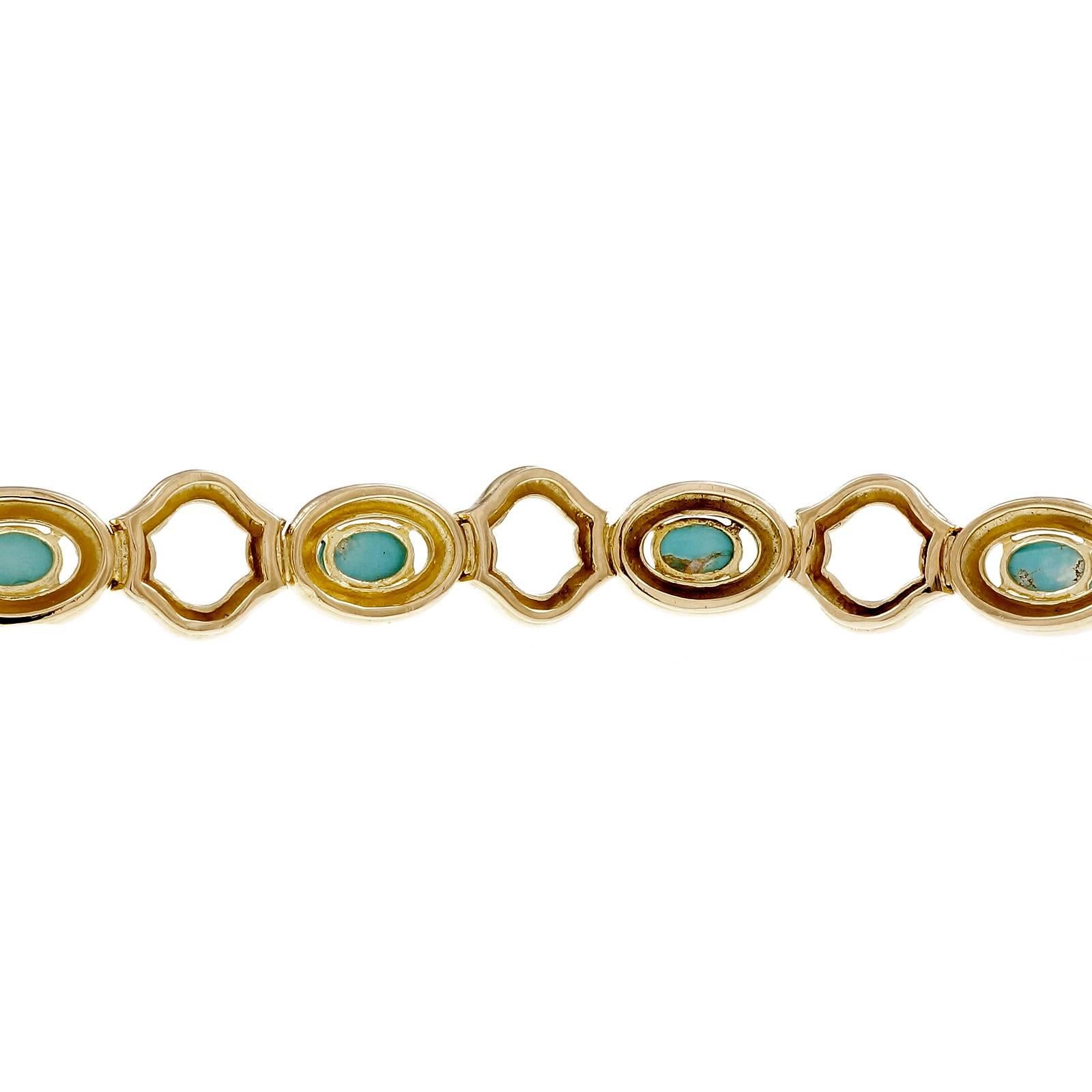 1960's Tiffany & Co 18k yellow gold hinged link bracelet. GIA certified natural untreated 6 oval Turquoise set in 18k yellow gold. 7 inches in length. 

6 oval cabochon blue Turquoise, no treatment, 7.86 x 5.49 x 3.31mm, GIA certificate