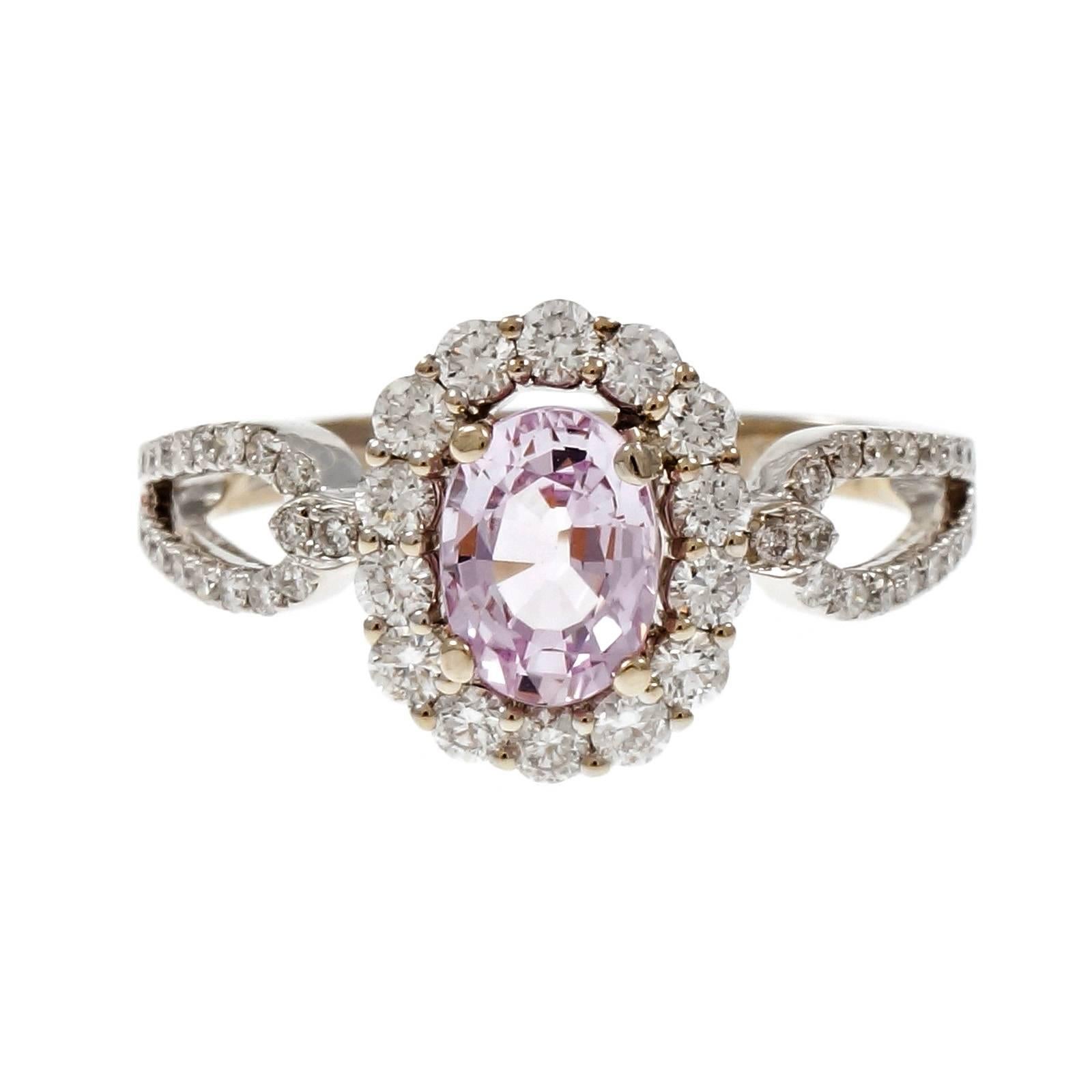 Pin oval sapphire and diamond halo engagement ring. Natural no heat GIA certified soft light pink Sapphire in an 18k white gold split shank setting with accent diamonds.

1 oval light pink Sapphire, approx. total weight 1.13cts, no heat, GIA