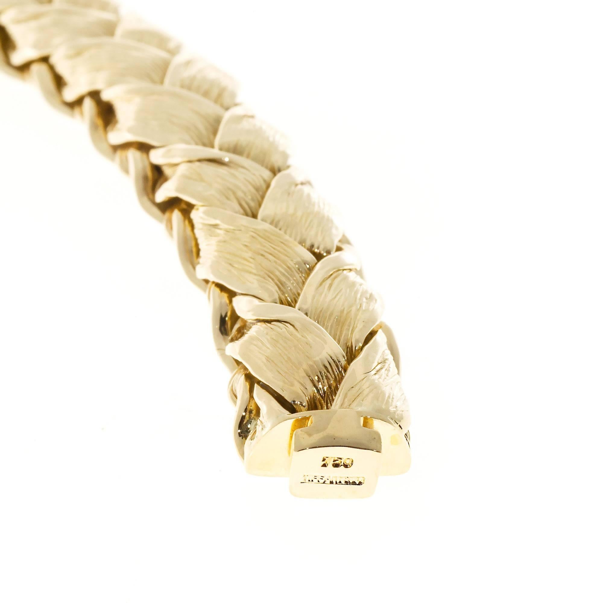 Tiffany & Co Textured Weave 18k Gold Bracelet. Circa 1950-1960. Heavy folded textured link bracelet made built in catch. When closed becomes a mostly stiff bangle. 

18k yellow gold 
Tested: 18k 
Stamped: 750 
Hallmark: Tiffany & Co 
78.1