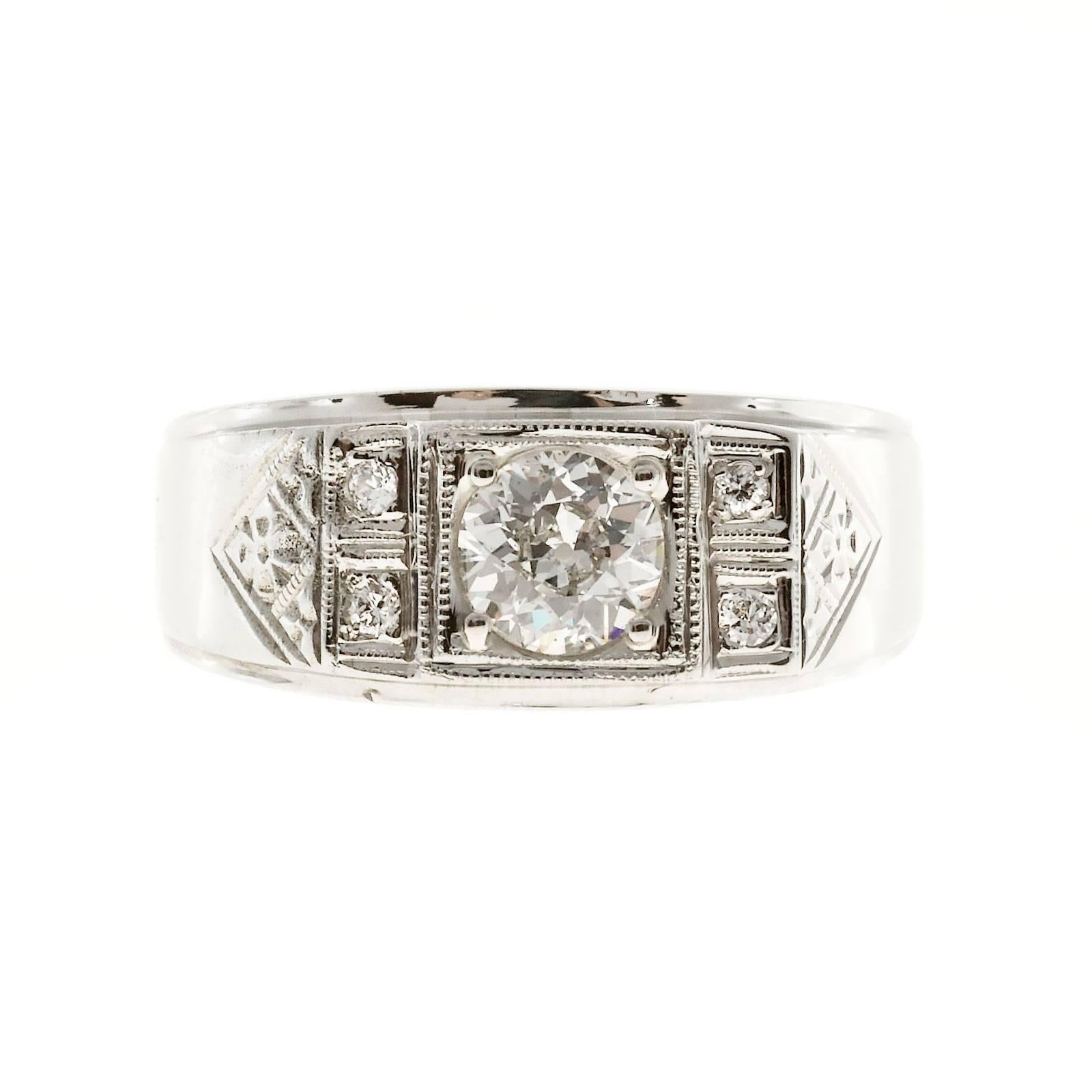 Retro men’s ring circa 1940 with hand engraving and side diamonds as well as a European cut GIA certified center diamond with raised crown and small table. Very sparkly.

1 old European cut diamond, approx. total weight .71cts, I, SI2, Depth: