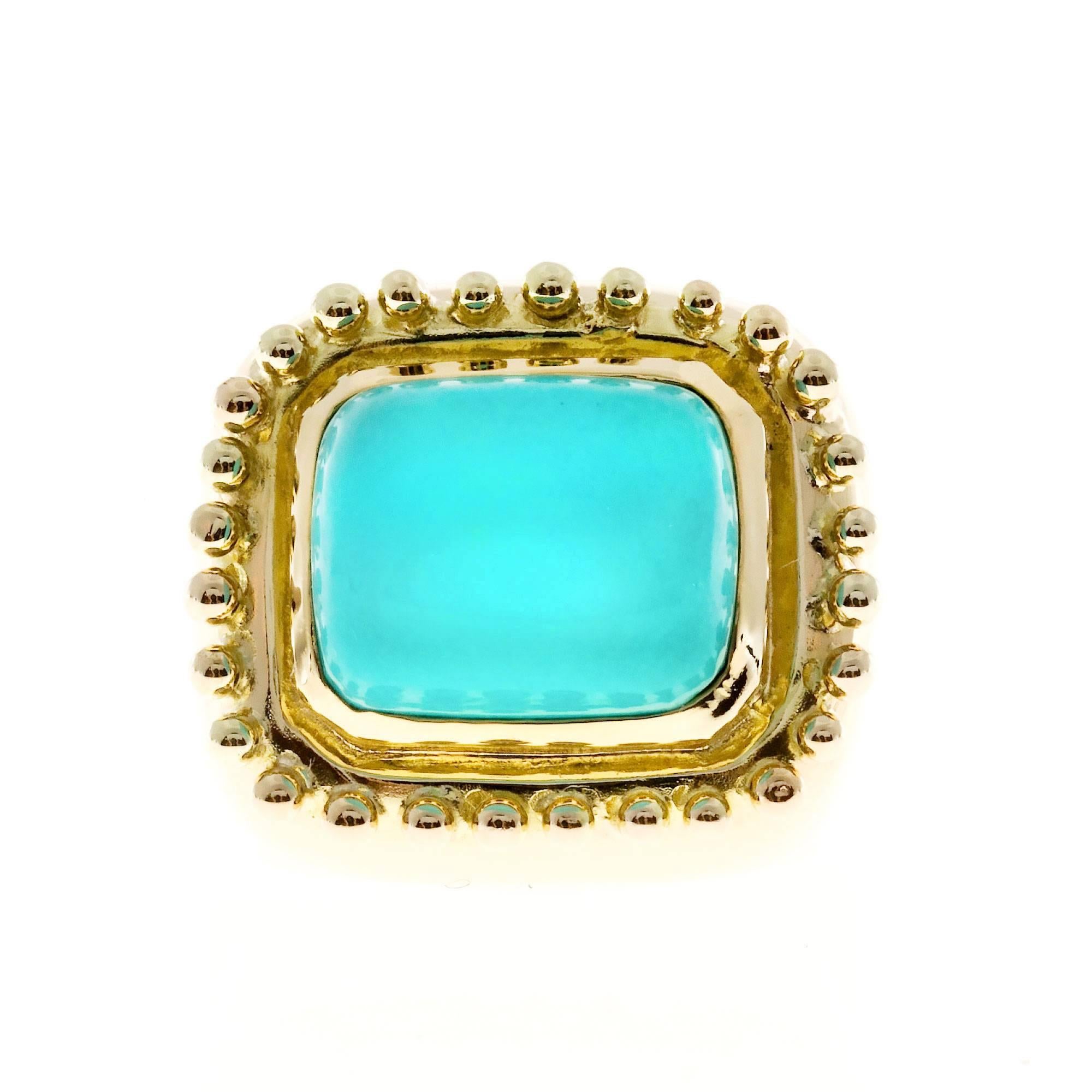 1960s heavy 14k yellow gold ring with a GIA certified natural untreated bright greenish blue Turquoise.

1 cabochon cushion greenish blue Turquoise, 10.98 x 13.62 x 16.15mm, GIA certificate #517254283
14k yellow gold
Tested: 14k
18.7