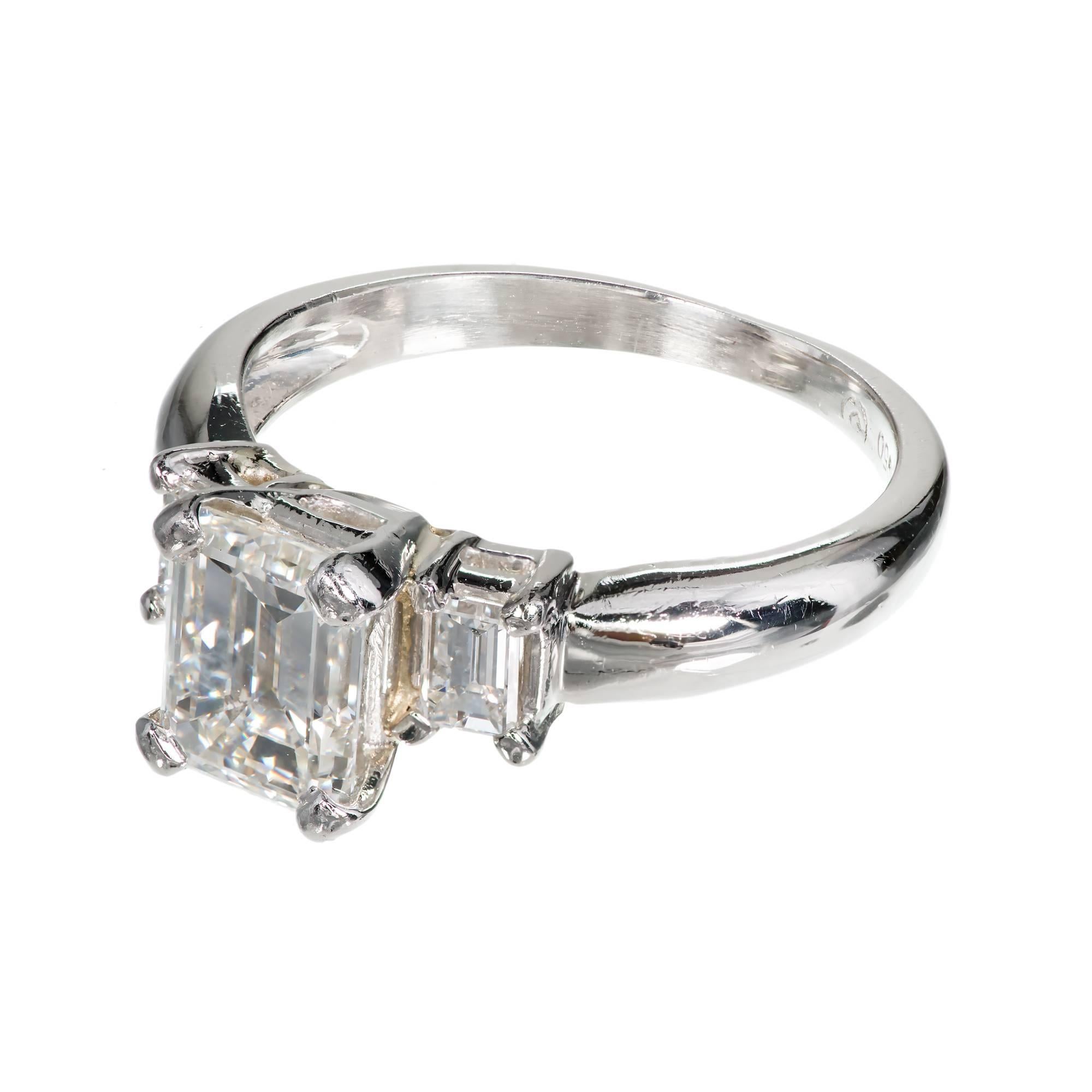Three Stone Emerald Cut Diamond Platinum Engagement Ring. Emerald cut center with brilliance and step cut pattern flanked by similar side diamonds in excellent proportion. 

1 Emerald cut diamond, approx. total weight 1.51cts, G, VS2, Depth: 67.8%