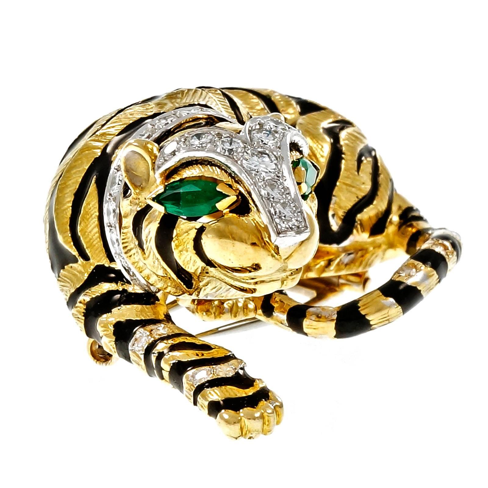 1960 David Webb Tiger pin authenticated by David Webb. Black enamel stripes. Diamond and Emerald accents.

25 round diamonds, approx. total weight 1.25cts, F – G, VS
10 single cut diamonds, approx. total weight .10cts, F – G, VS
2 Marquise