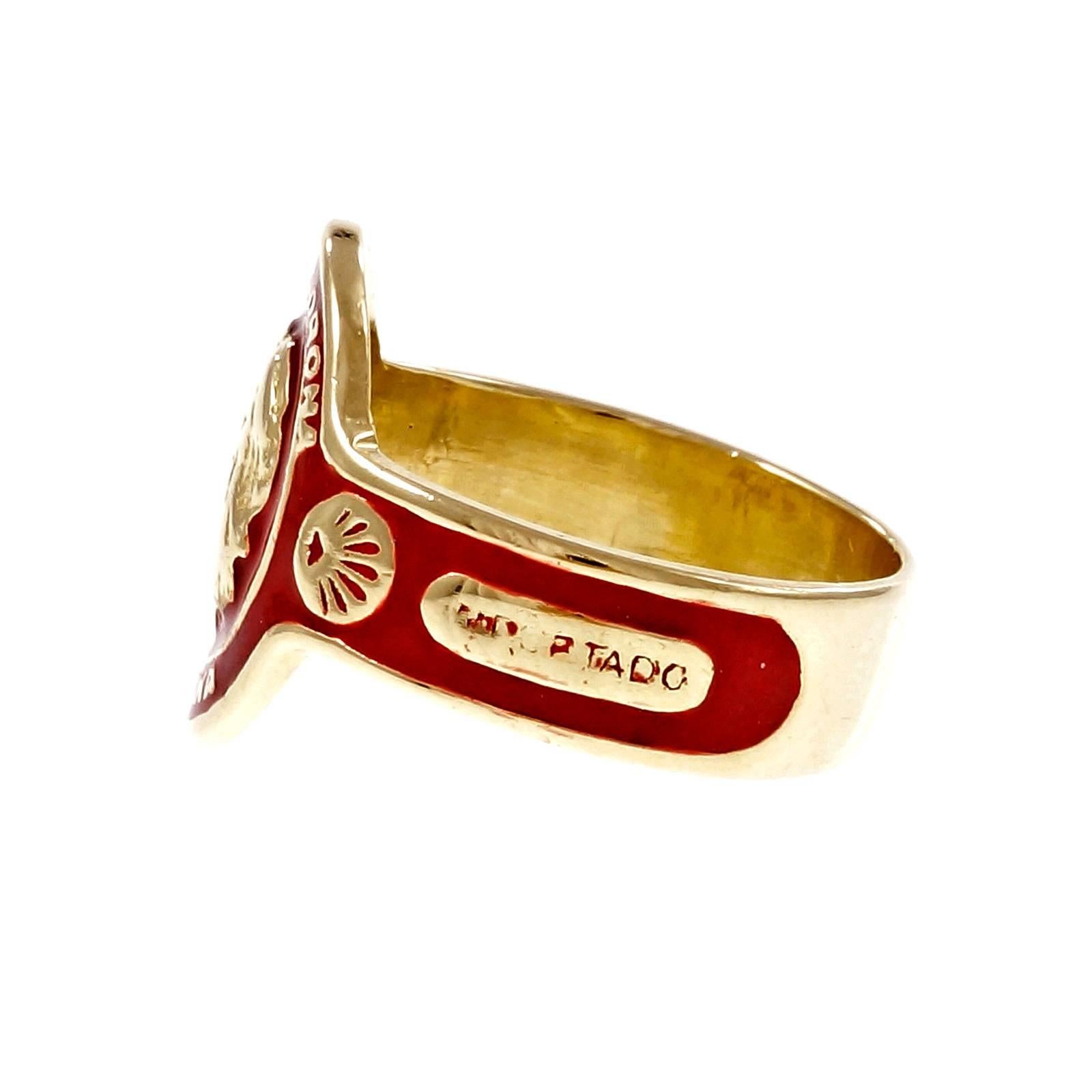 1970’s Cartier Corona Corona Habana Gold Red Enamel Cigar Band Ring. 

18k yellow gold
Tested and stamped: 18k
Hallmark: Cartier 38544 36 366 Importado Corona Corona Habana Importado
7.2 grams
Width at top: 16.77mm
Height at top: