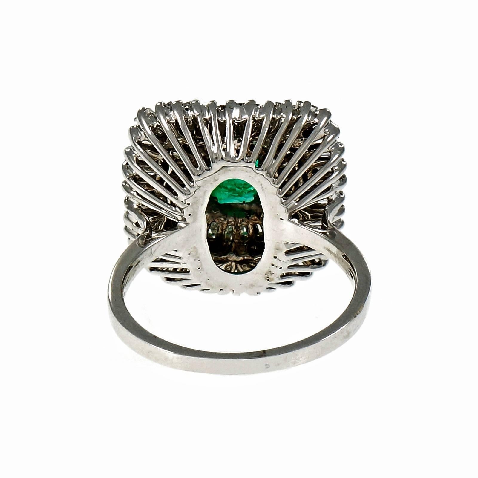 1960-1970 Ballerina style ring with baguette diamonds and a GIA certified bright green Emerald. Natural Emerald clarity enhanced only.

1 green Emerald cut Emerald, approx. total weight 2.31cts, 8.80 x 6.73 x 4.22mm GIA cert# 2175585963
68