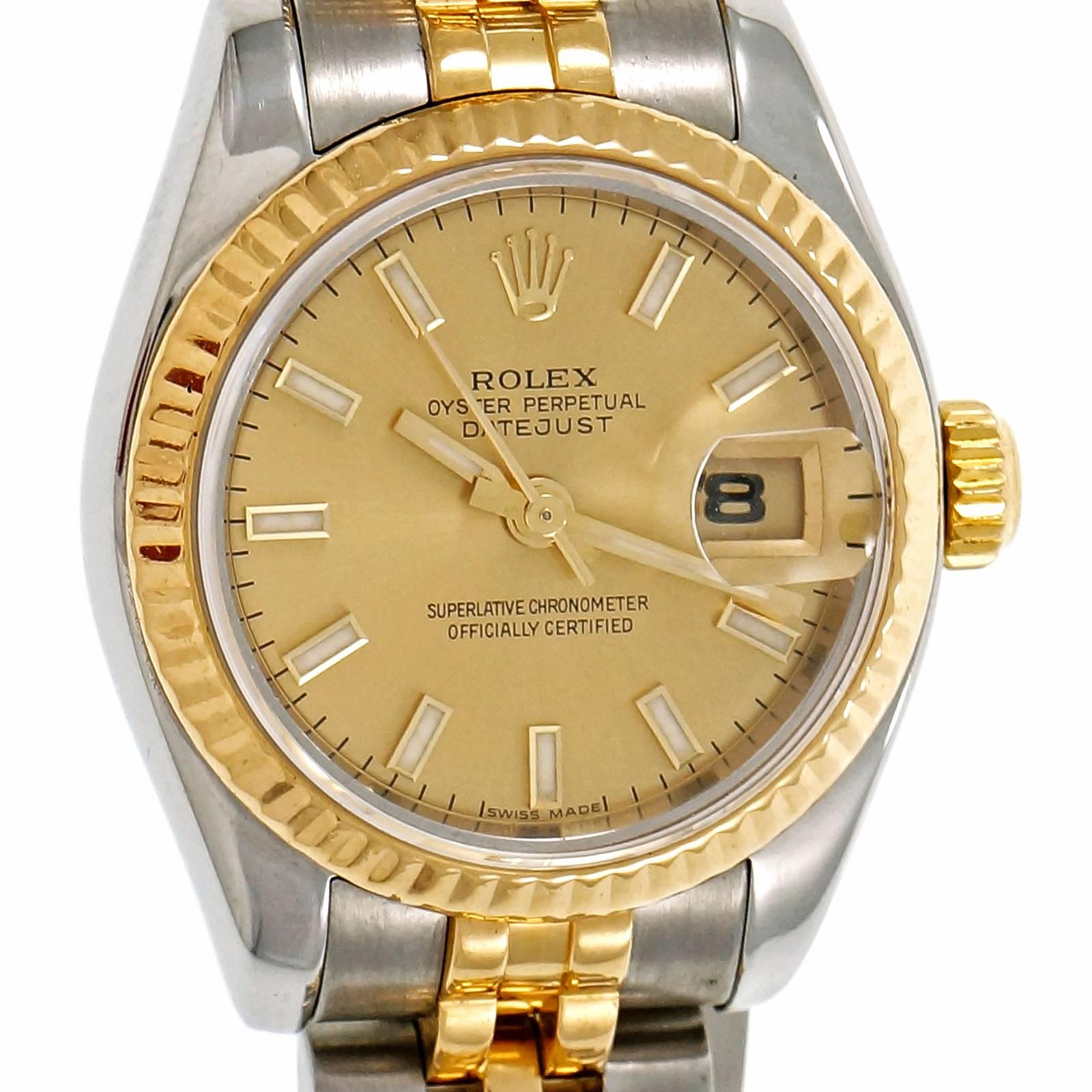 Rolex Ladies Gold Steel Datejust Wristwatch ref 179173 with solid links and hidden fold over clasp in 18k yellow gold and steel. Model 179173. 

18k yellow gold and steel 
Length: 7.25 inches  can be shortened 
Length: 33mm 
Width: 26mm 
Band