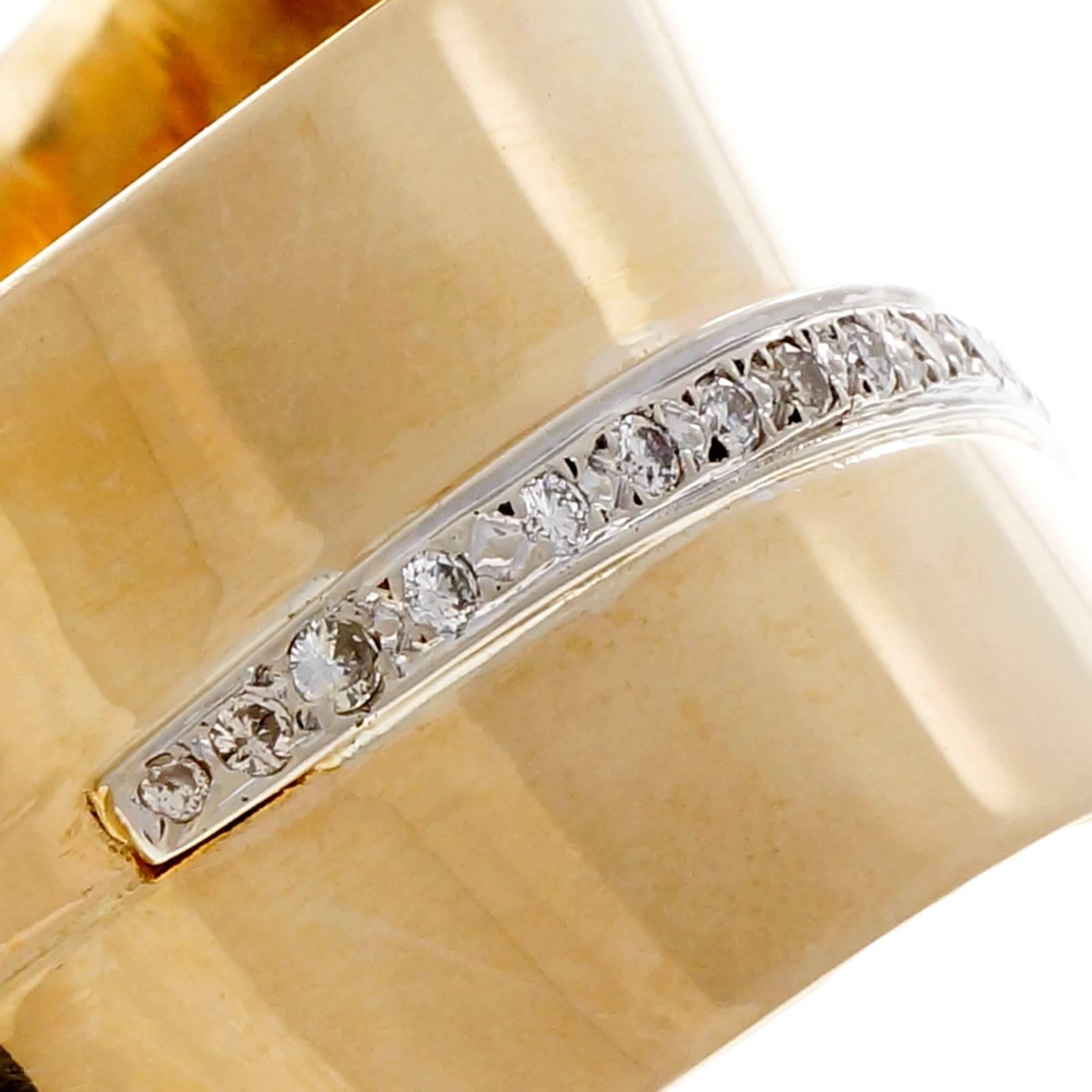 1950's Large modernist double spring loaded diamond gold bangle bracelet, with 21 round diamond accents in 14k yellow and white gold.  Fits up to 7.5 wrist. 

21 round diamonds, approx. total weight .63cts, H, VS2 – SI1
14k yellow gold & white