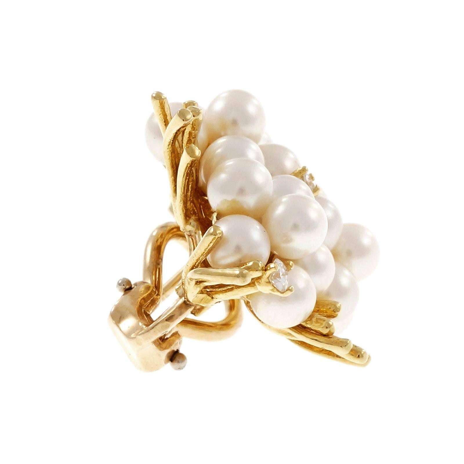 Pearl Diamond Spray Design clip post Earrings. 26 round Akoya pearls accented with 4 round cut diamonds in 18k yellow gold. Clip and pierced post for comfortable and secure wear. Circa 1960-1970.

26 round fine white Akoya cultured pearls, 4 –
