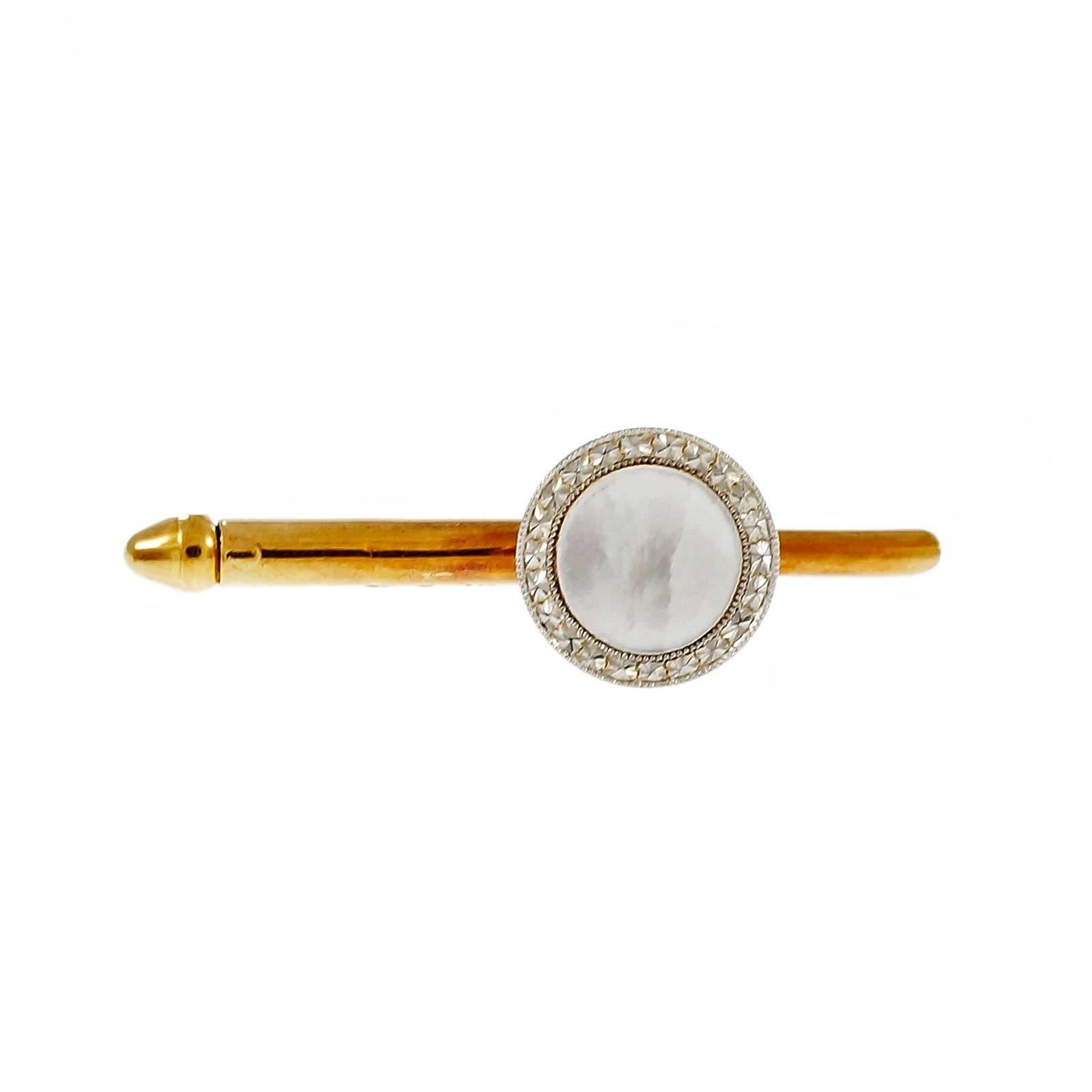 1900-1909 men’s dress set 2 double sided cuff links, four vest or waist coat studs, 3 shirt studs, Platinum rims and white Mother of Pearl centers. 

14k gold with natural patina.
14k yellow gold and Platinum
4 white Mother of Pearl, 10.86mm
4
