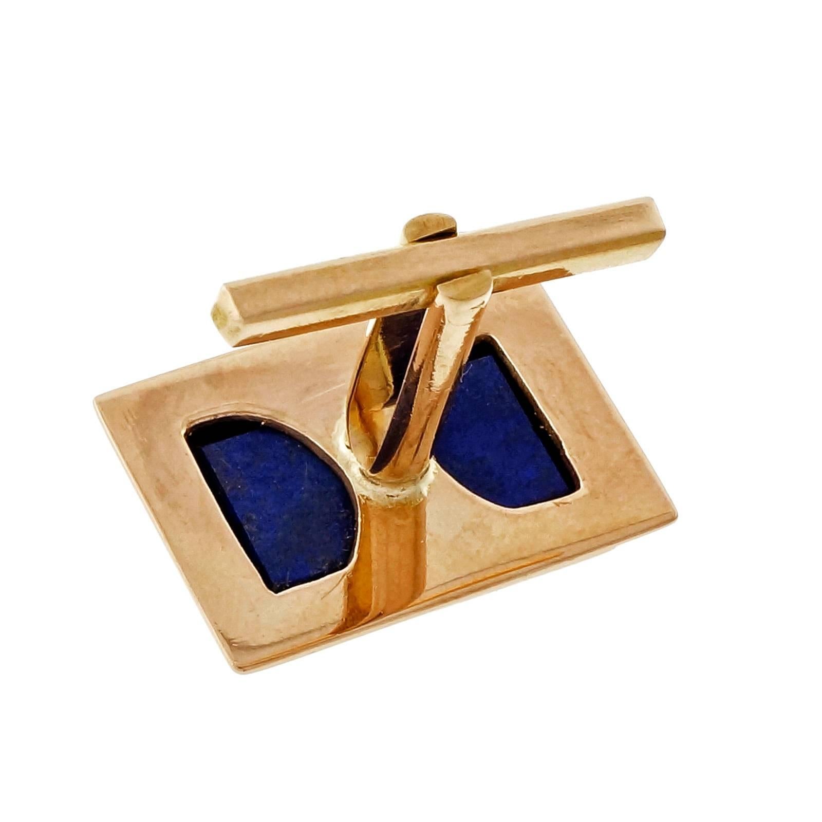 Handmade rectangular fine blue Lapis cuff links in 18k Rose gold. Circa 1940-1949.

2 rectangular pieces of blue Lapis, 10.48 x 15.58 x 3.34mm
18k rose gold
Top to bottom: 14.66mm or .57 inch
Width: 19.91mm or .78 inch
Depth: 4mm
12.3 grams
