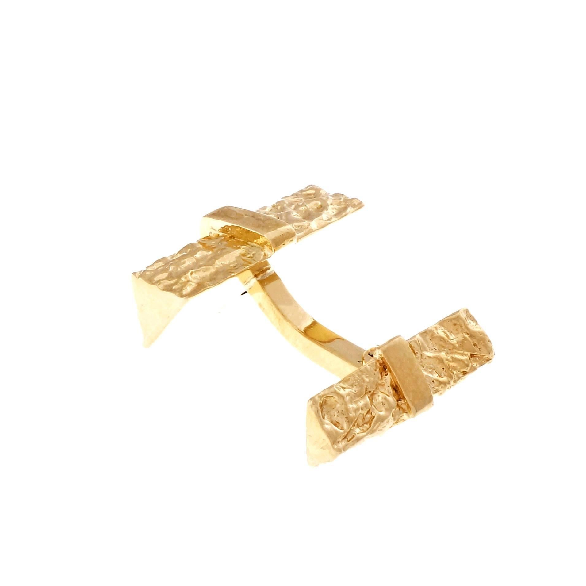 1960 18k yellow gold 2 sided angular bark design clip back cuff links.

18k yellow gold
Tested and stamped: 18k
Hallmark: 1
Top to bottom: 20.87mm or .82 inch
Width: 13.04mm or .51 inch
Depth: 7.21mm
22.4 grams
