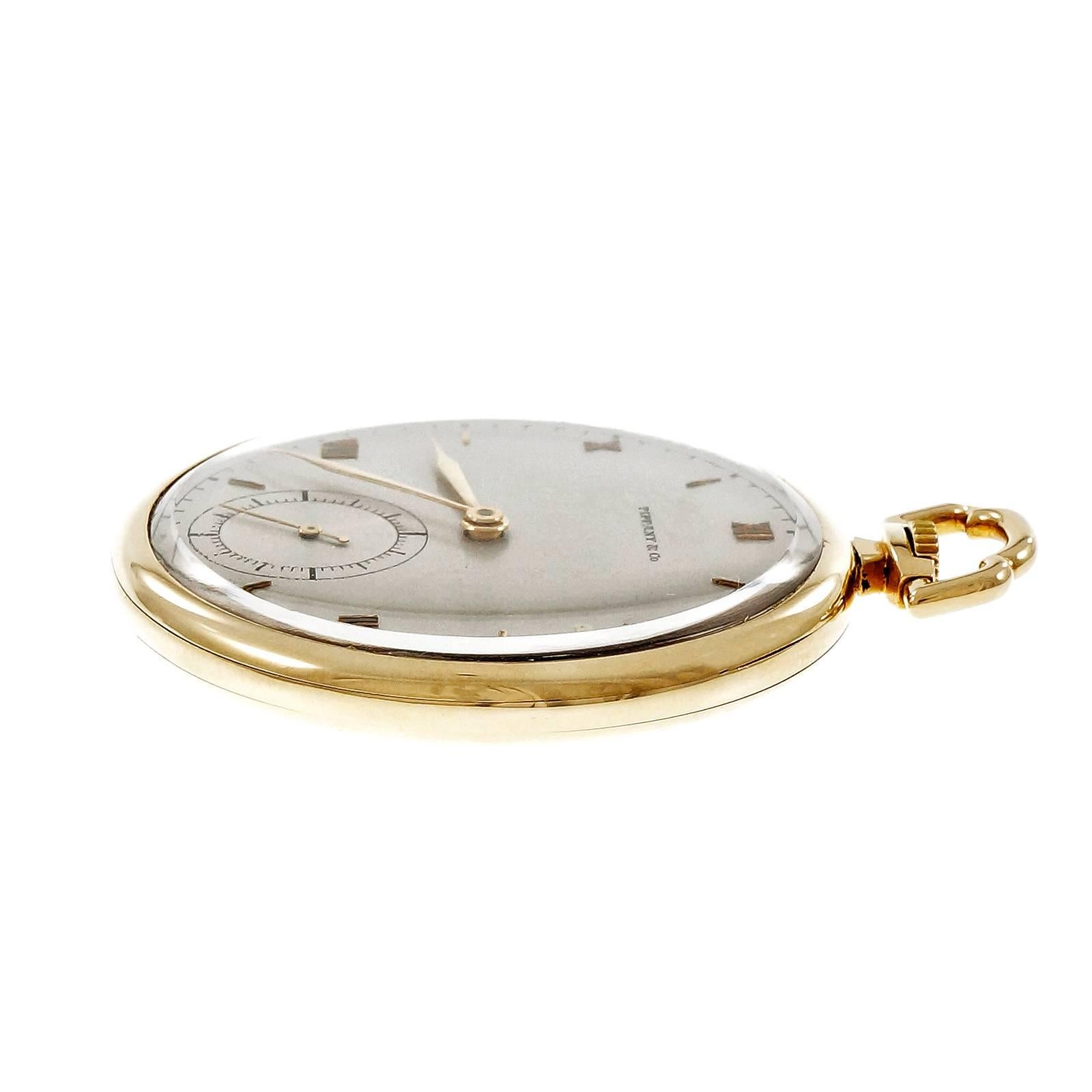 Tiffany & Co solid 14k yellow gold open face high grade pocket watch. Pristine dial, simple plain case and case back. One owner since 1943. Meylan 21 jewel manual wind movement. Double back cover. Engraved for presentation inside case in 1943.
