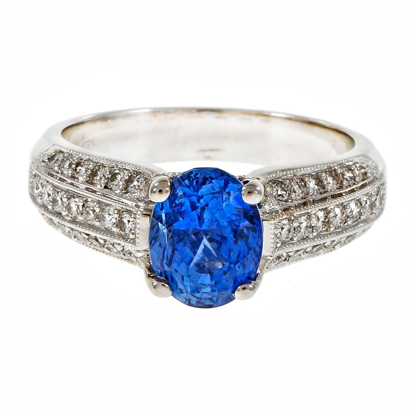 Bright blue oval Sapphire and round diamond engagement ring. GIA certified simple heat only. Bright white diamonds in a 18k white gold setting.

1 oval blue Sapphire, approx. total weight 2.64cts, simple heat, GIA certificate #2175101370
42 round