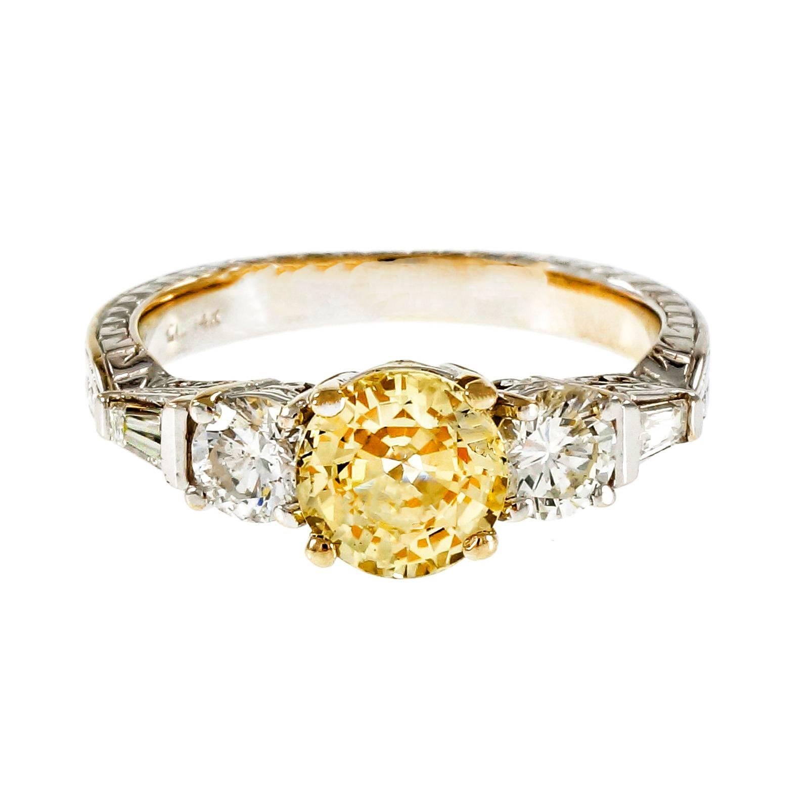 Natural no heat light yellow Sapphire engagement ring. With an European cut and GIA certified sapphire in a 14k white gold engagement ring from Peter Suchy with round and baguette diamonds. 

1 round light yellow Sapphire, approx. total weight