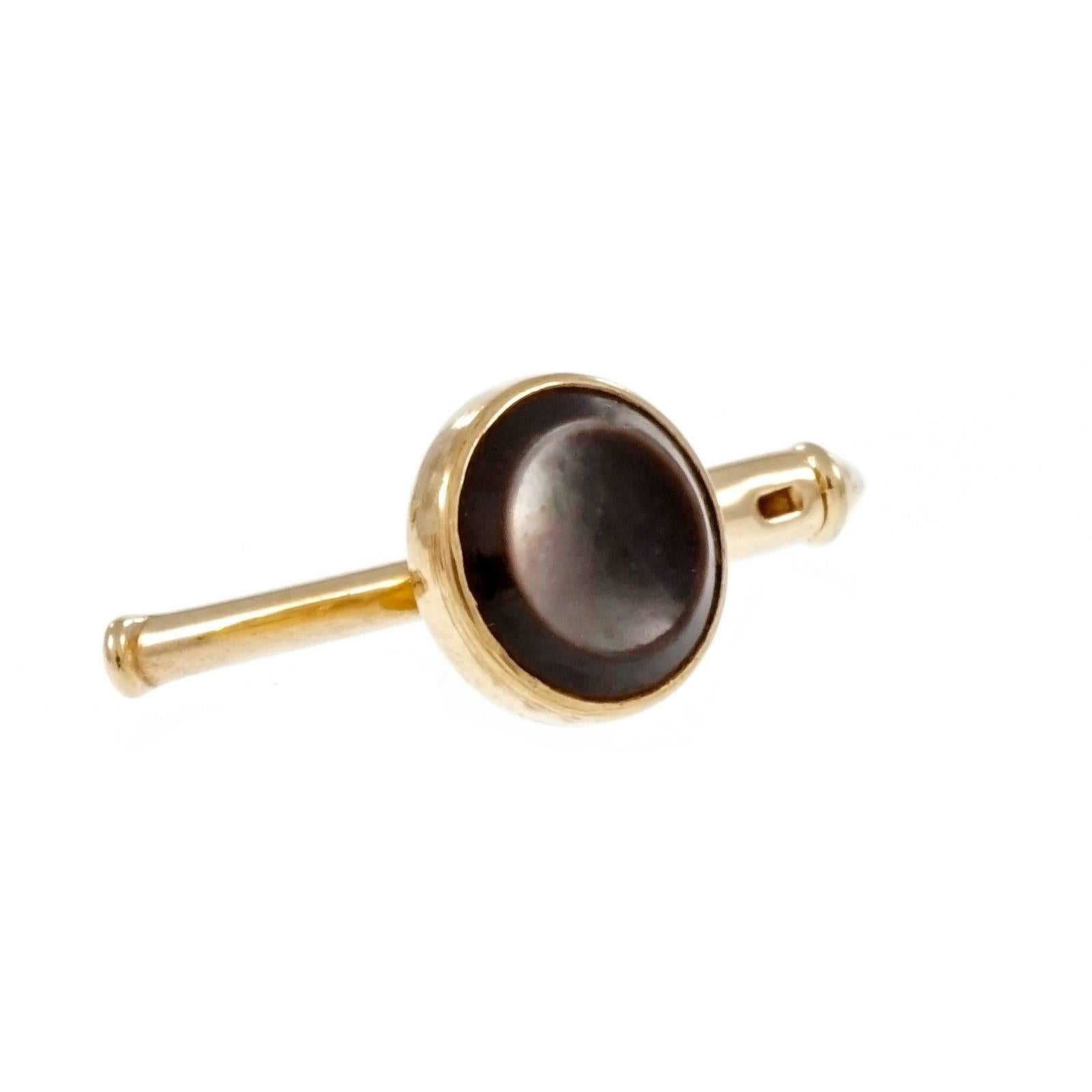 Larter & Sons black Mother of Pearl over black Onyx 10k yellow gold cufflinks and 3 piece shirt stud set, circa 1920.

4 Mother of Pearl over Onyx 12.70mm
3 Mother of Pearl over Onyx 7.45mm
10k yellow gold
Tested: 10k
Stamped: 10
Hallmark: