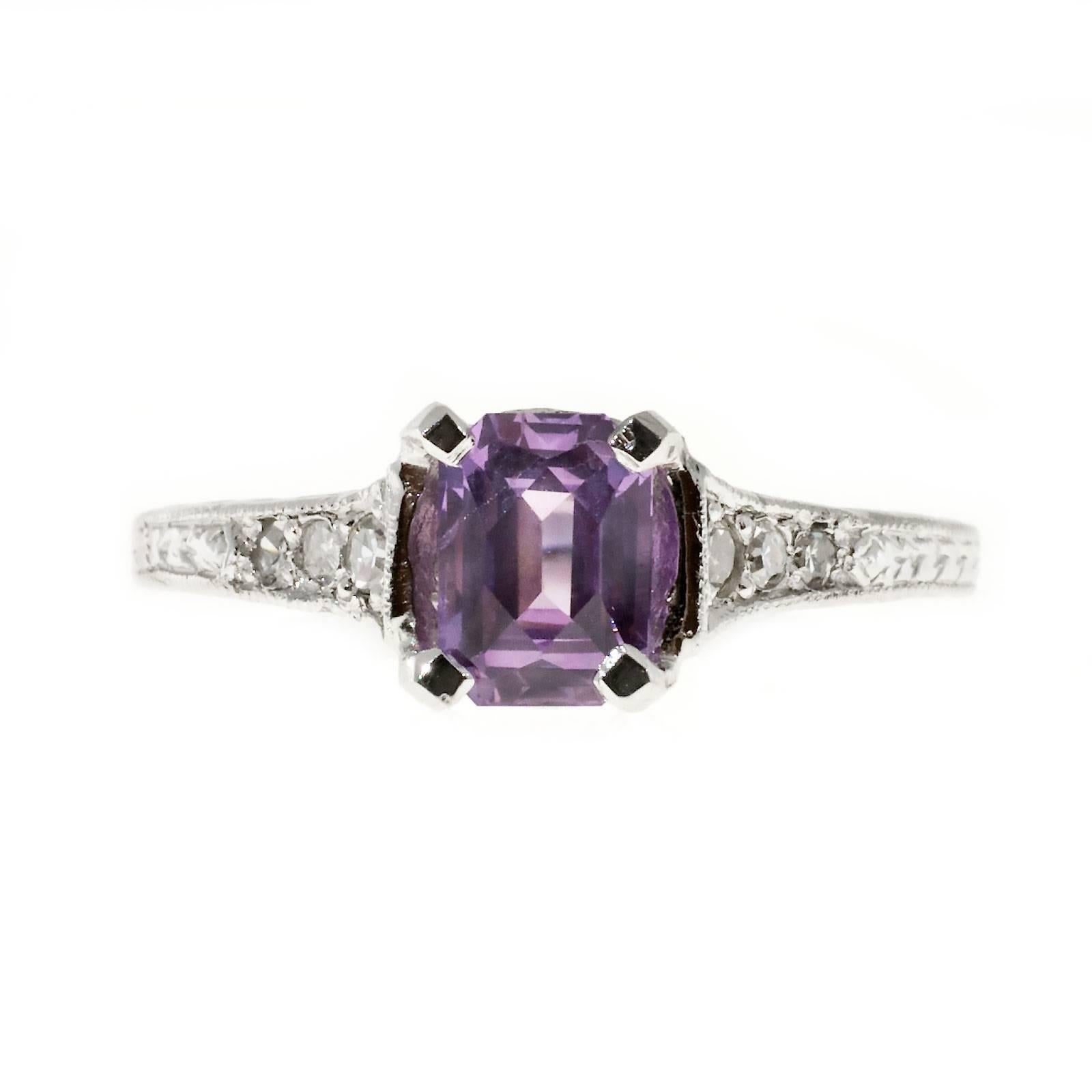 Original Art Deco 1920 Platinum engagement ring with a rare natural certified Emerald step cut sapphire with a rare pinkish purple color. Bright clear crisp color.

1 octagonal pinkish purple modified step cut Sapphire, approx. total weight 1.07cts,