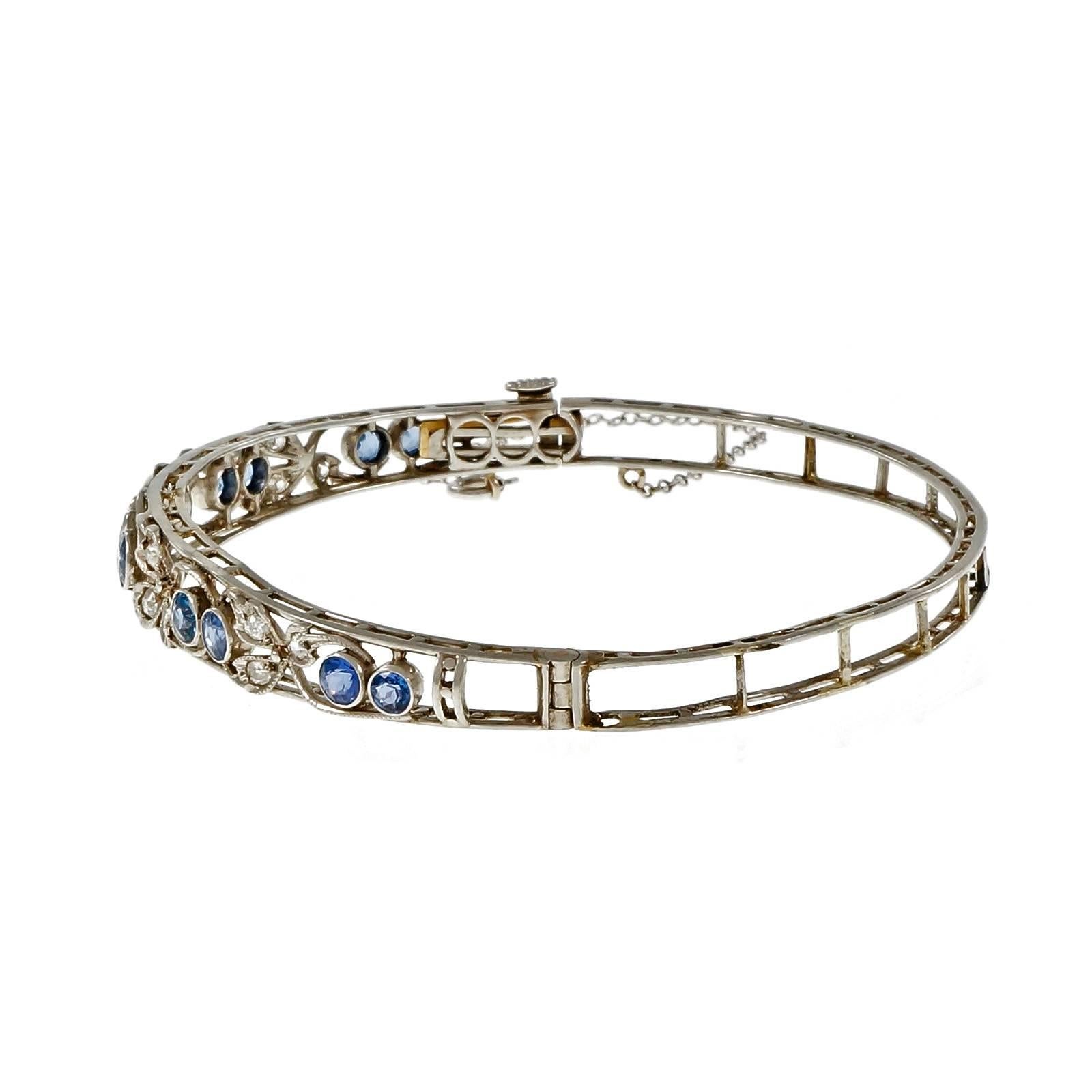 Early 1900’s Edwardian bangle bracelet handmade in Platinum with natural GIA certificate # certified no heat Montana Sapphires with diamond accents. Circa 1900s.

10 round bright blue Montana Sapphires, approx. total weight 2.50cts, VS – SI, 3.19
