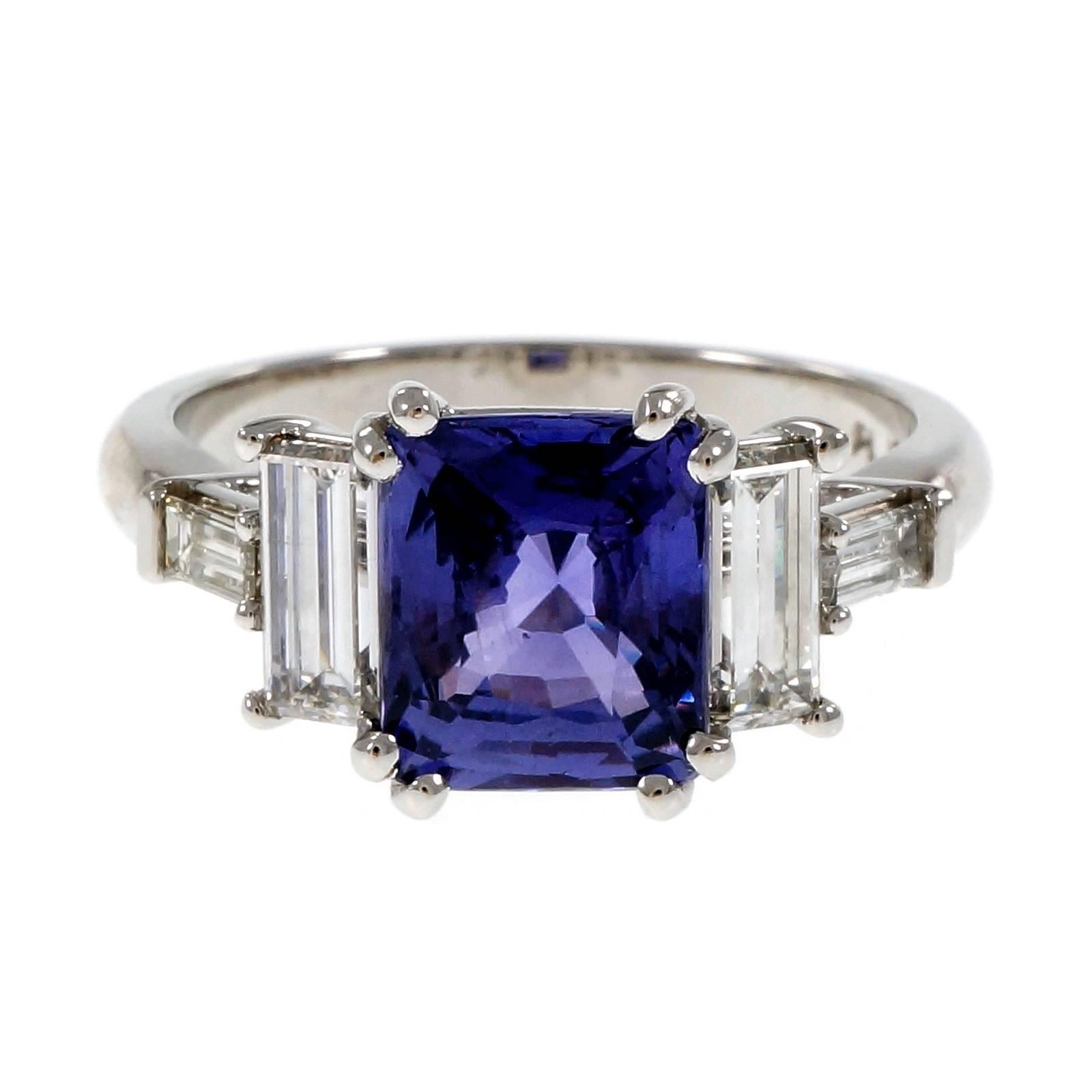 Natural no heat violet color change square brilliant cut Sapphire engagement ring. Changes color in different lights from violet to purple. Made from the Peter Suchy Workshop in Platinum with Emerald and baguette cut diamonds.

1 cushion color