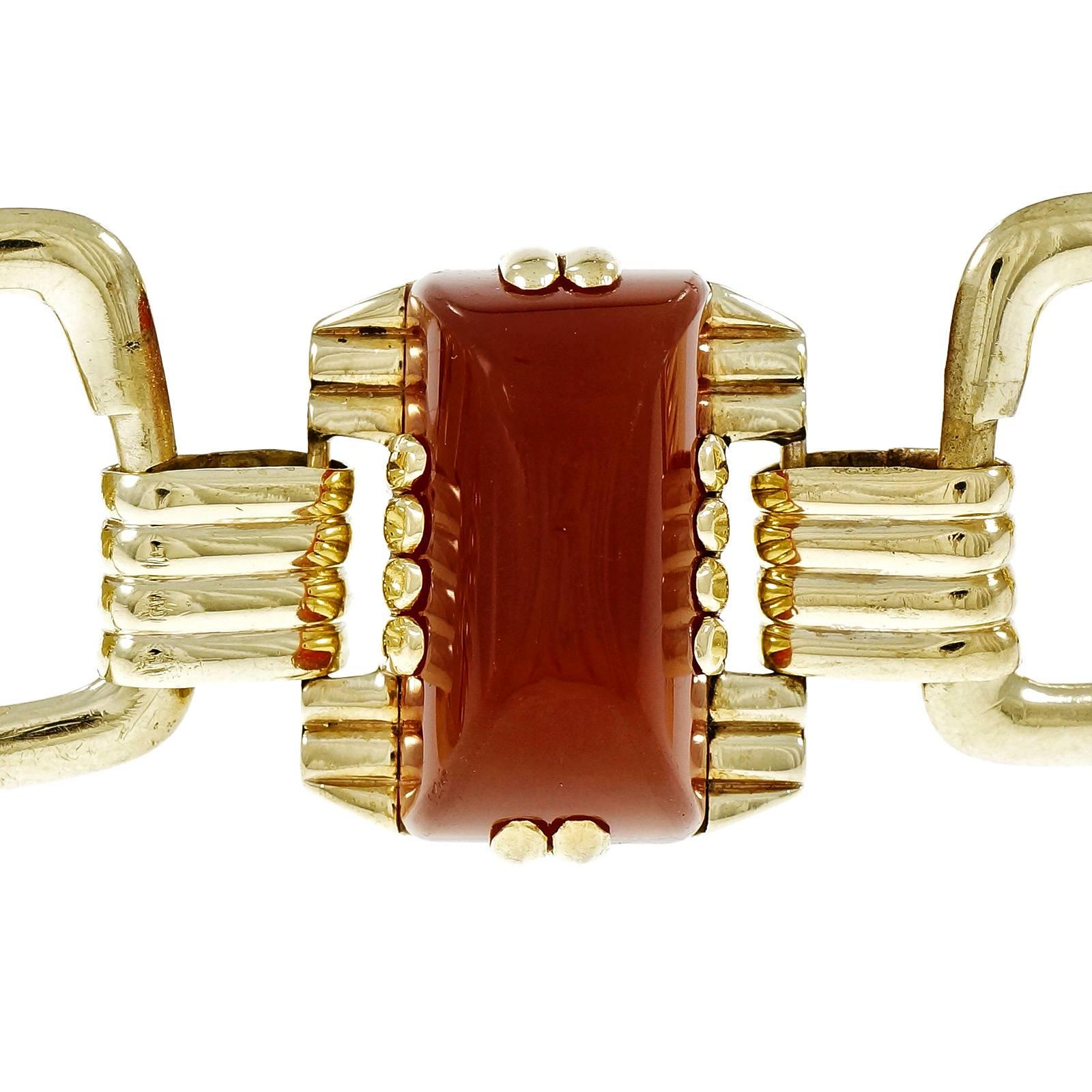 Modernist 1940-1949 Carnelian and Chrysophase bracelet in 14k yellow gold, with a hint of green.  All original including heavy spring ring catch.

1 rectangular sugar loaf Carnelian, 26 x 13.97mm
2 rectangular sugar loaf Chrysophase, 25.84 x
