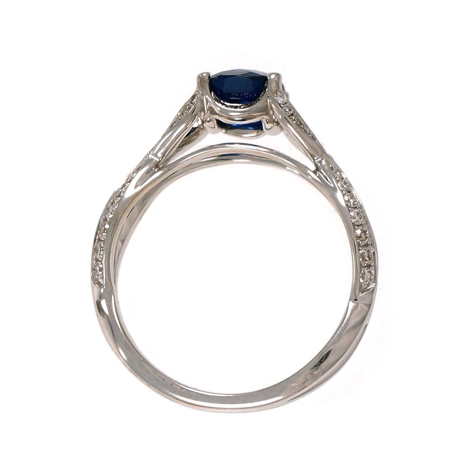 Natural no heat cushion Sapphire and diamond engagement ring, in an 18k white gold settng.

1 cushion Royal Blue Sapphire, approx. total weight 1.25cts, no heat, AGL certificate#GB109011
70 round diamonds, approx. total weight .38cts, F, VS
18k