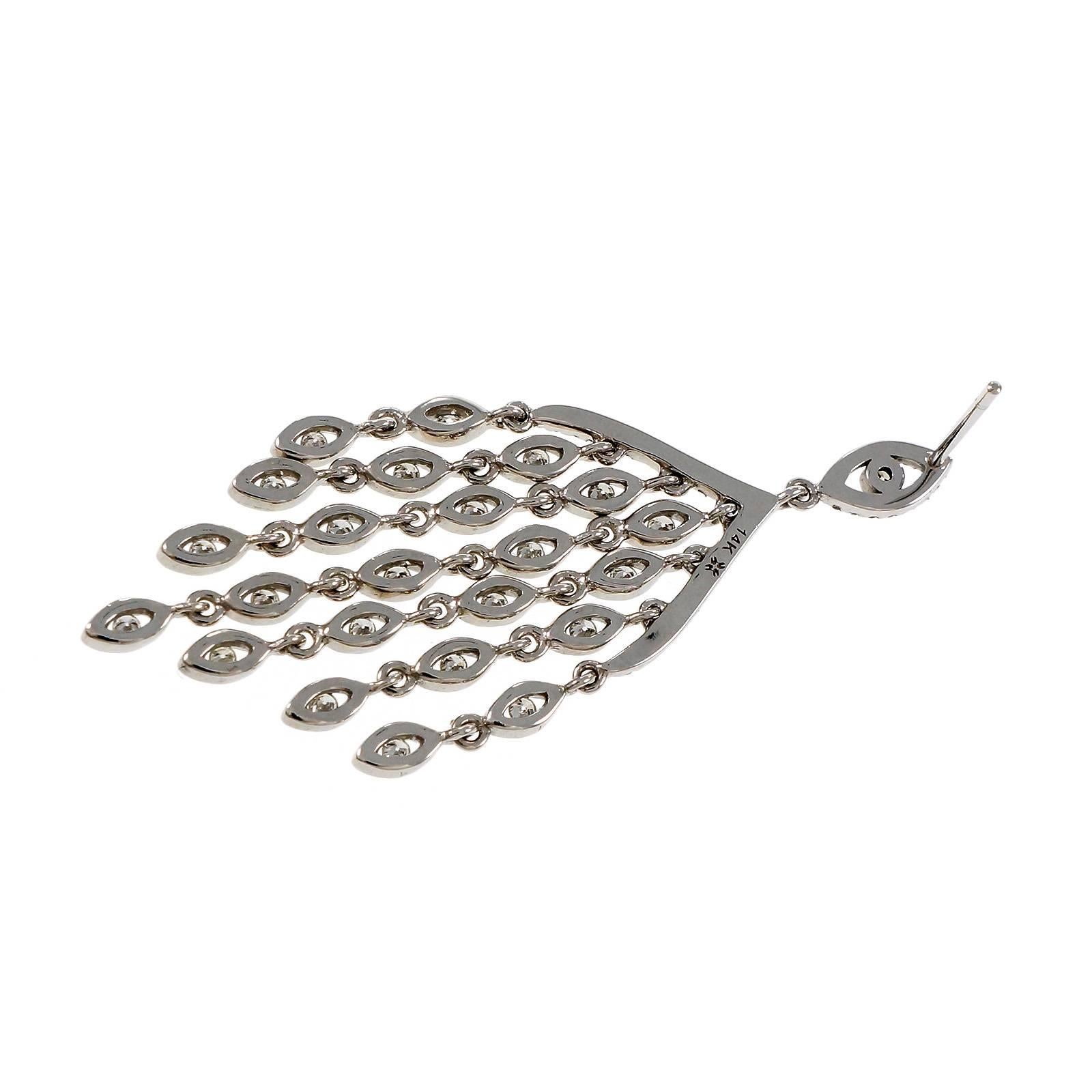 Diamond 14k white gold chandelier style dangle earrings with bright white full cut diamonds.

126 round full cut diamonds, approx. total weight 1.00cts, G, SI1
14k white gold
Tested and stamped:  14k
9.6 grams
Top to bottom: 49.07mm or 1.93