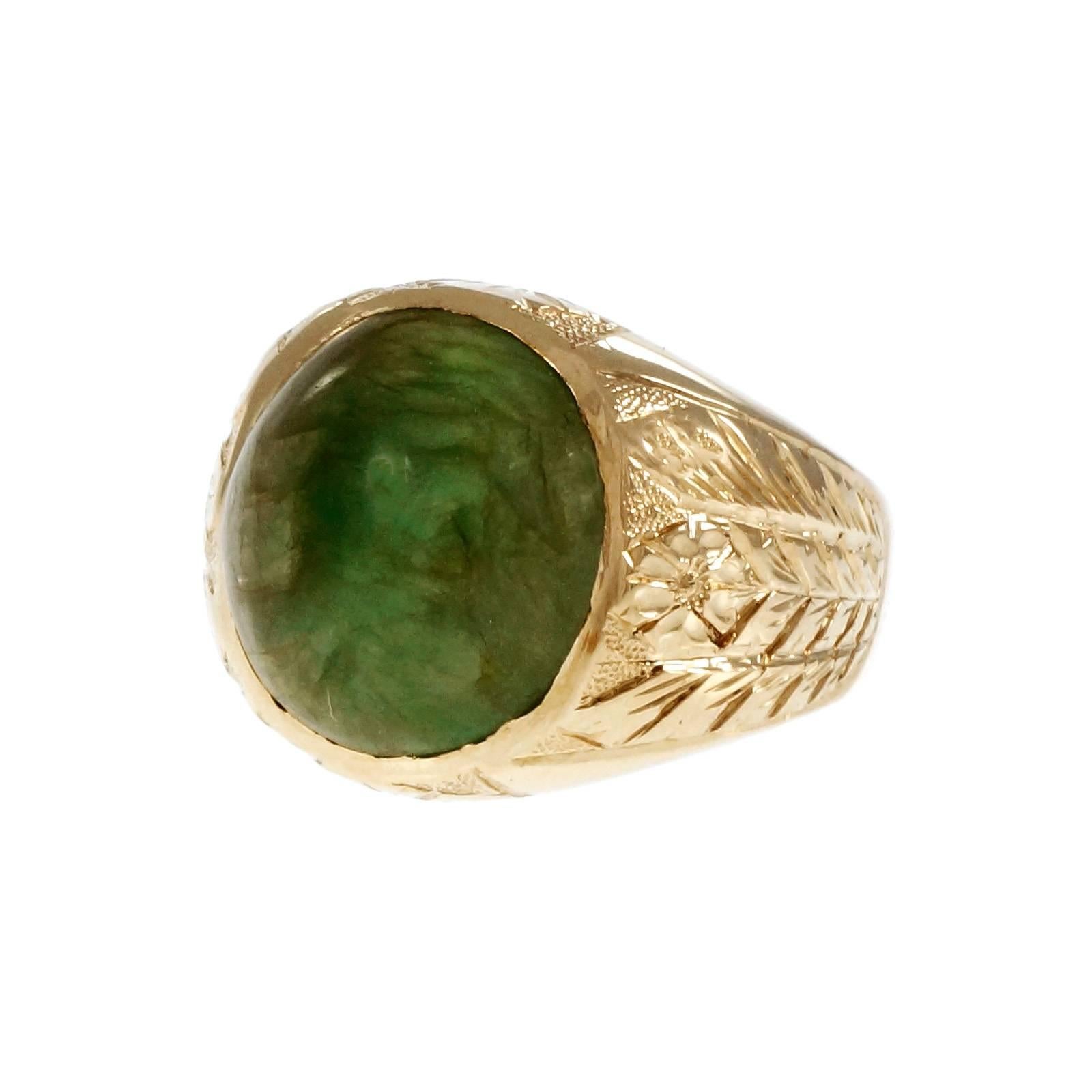 Early men’s natural certified Jadeite Jade ring circa 1920-1929 with deep hand engraving. The Jade is highly translucent with an interesting zoning of color and moderate inclusions. Well-polished no dye or enhancements.

1 oval cabochon yellowish