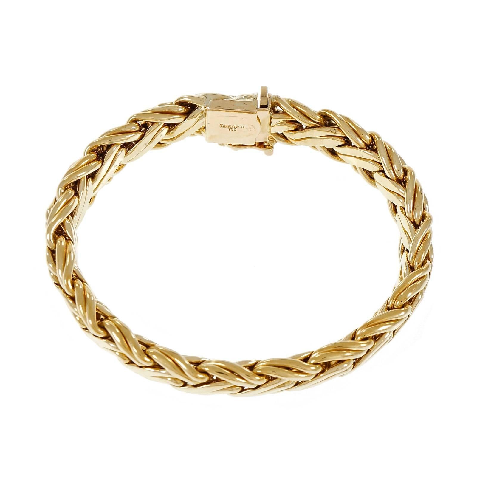 Tiffany & Co 18k yellow gold Russian weave braid woven bracelet. 

18k yellow gold
34.4 grams
Tested: 18k
Stamped: 750
Hallmark: Tiffany & Co
Length: 7.625 inches
Width: 9.75mm
Depth: 5.30mm

