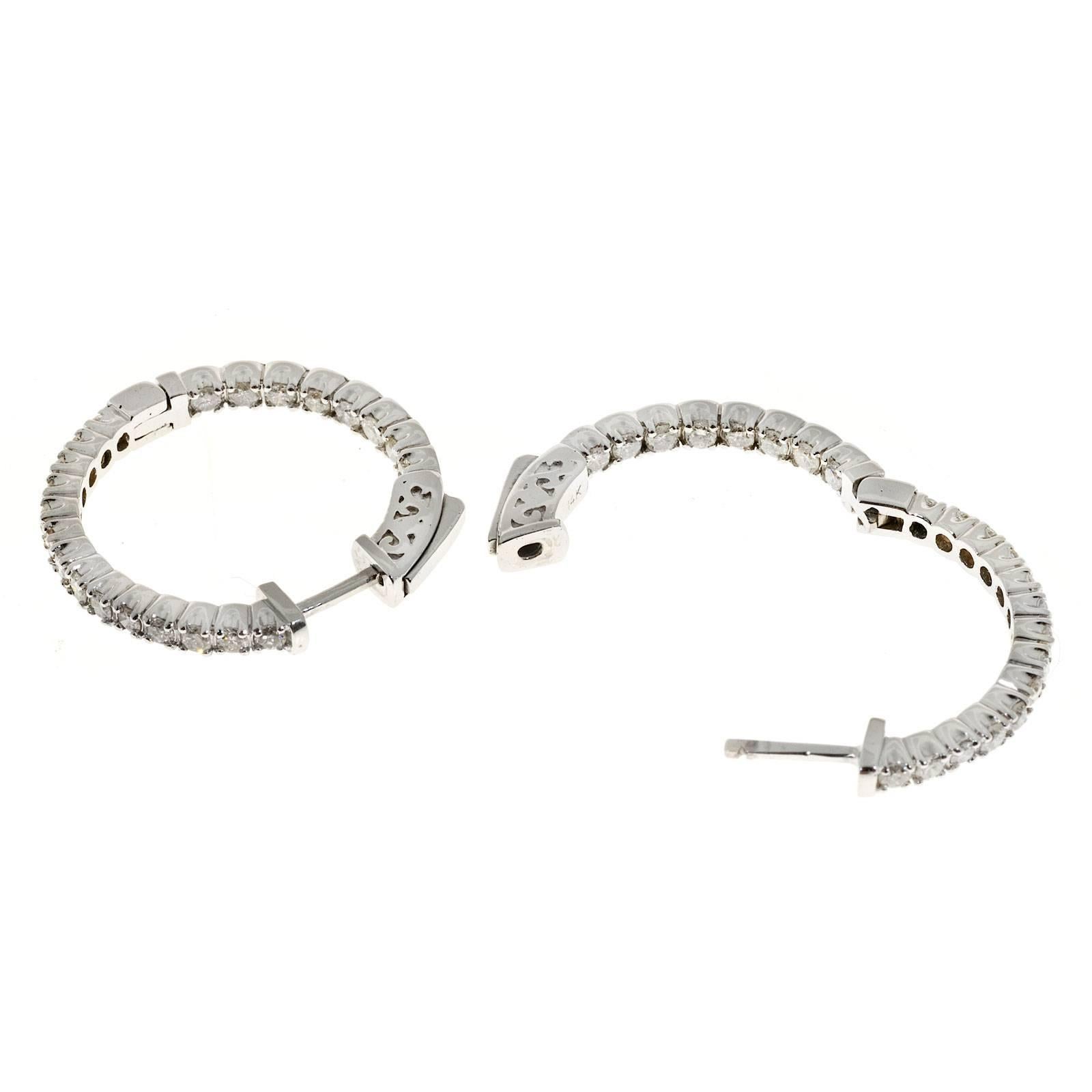 Inside out 14k white gold hoop earrings with secure spring loaded tops.

44 round diamonds, approx. total weight .90cts, H, SI1
14k white gold
Tested and stamped: 14k
7.0 grams
Top to bottom: 24.71mm or .97 inch
Width: 2.64mm or .10