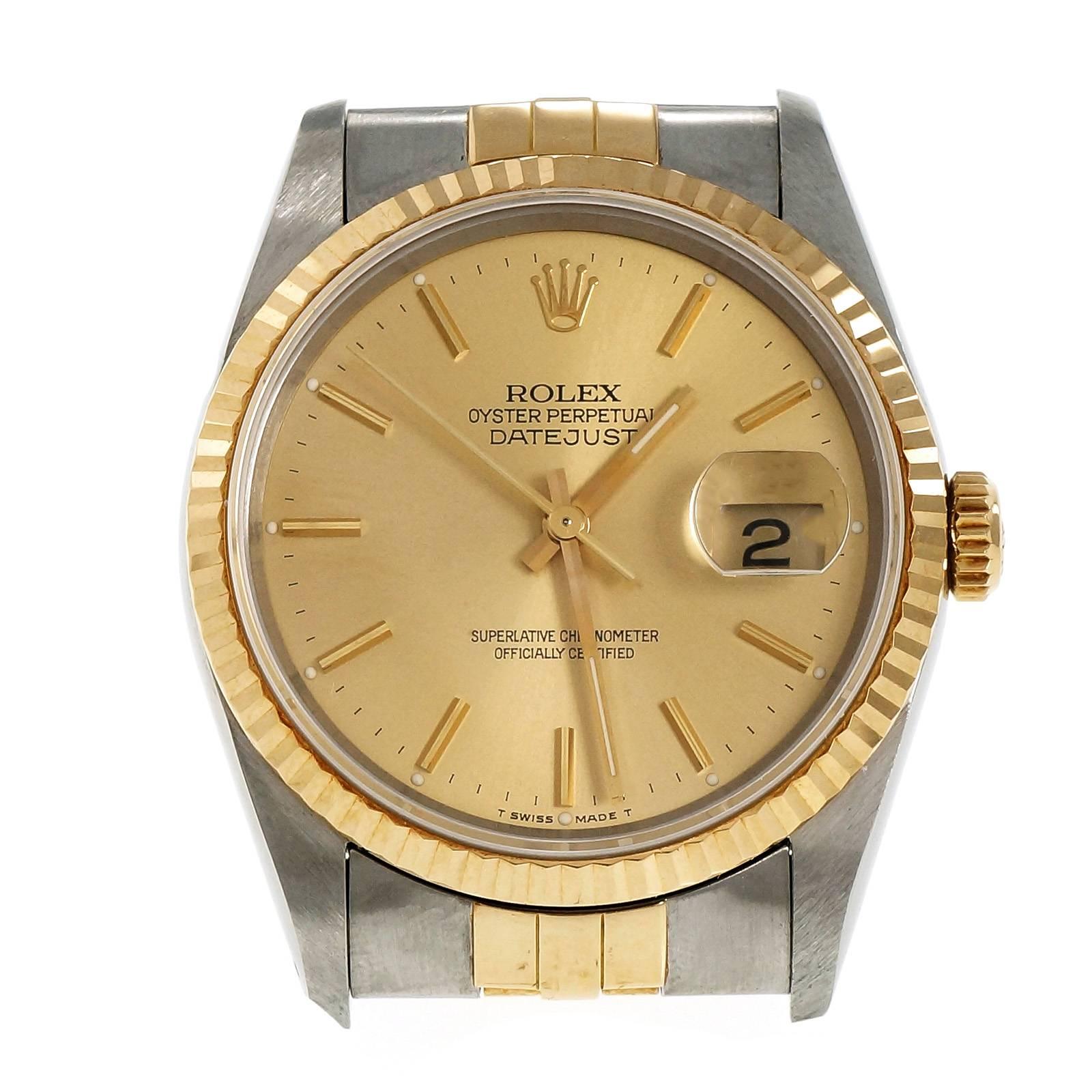1991 Rolex Datejust 18k gold and steel wristwatch. Tight band and buckle. Original case back sticker.  Original papers. Circa 1991.

Band length: 7.75 inches – can be shortened – links available to lengthen
104.7 grams
Length: 43.6mm
Width: