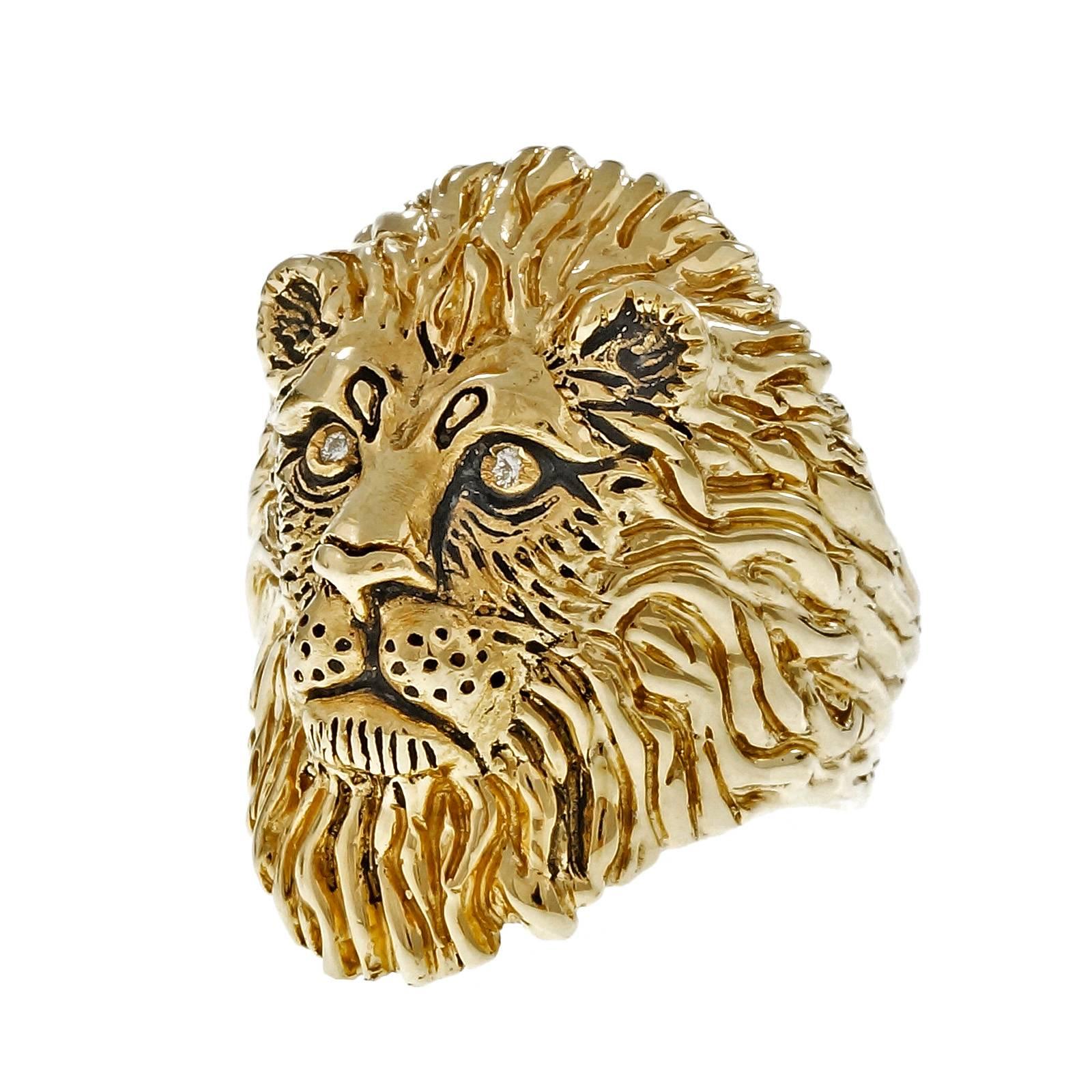 Gregory Appleby lion ring #1/100 in 14k yellow gold with diamond eyes. Circa 1994.

2 round diamonds, approx. total weight .04cts, G – H, VS
14k yellow gold
16.5 grams
Tested and stamped: 14k
Hallmark: © 1994 g Appleby 9p 1/100
Width at top: