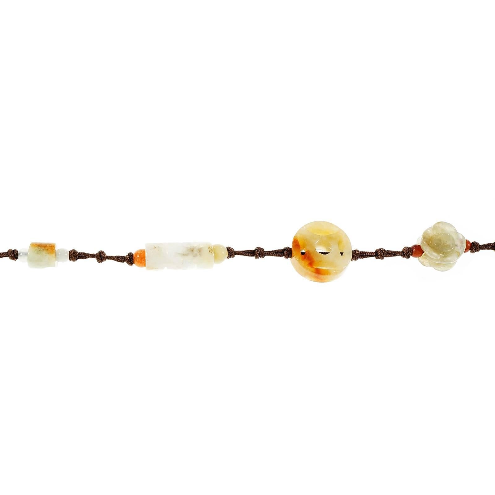 GIA certified natural Jadeite Jade carved multi stone multi color necklace. The larger circle in the middle and one other Jade were random tested as natural untreated Jadeite Jade.

113 carved ring and oval white, light green, orange and red