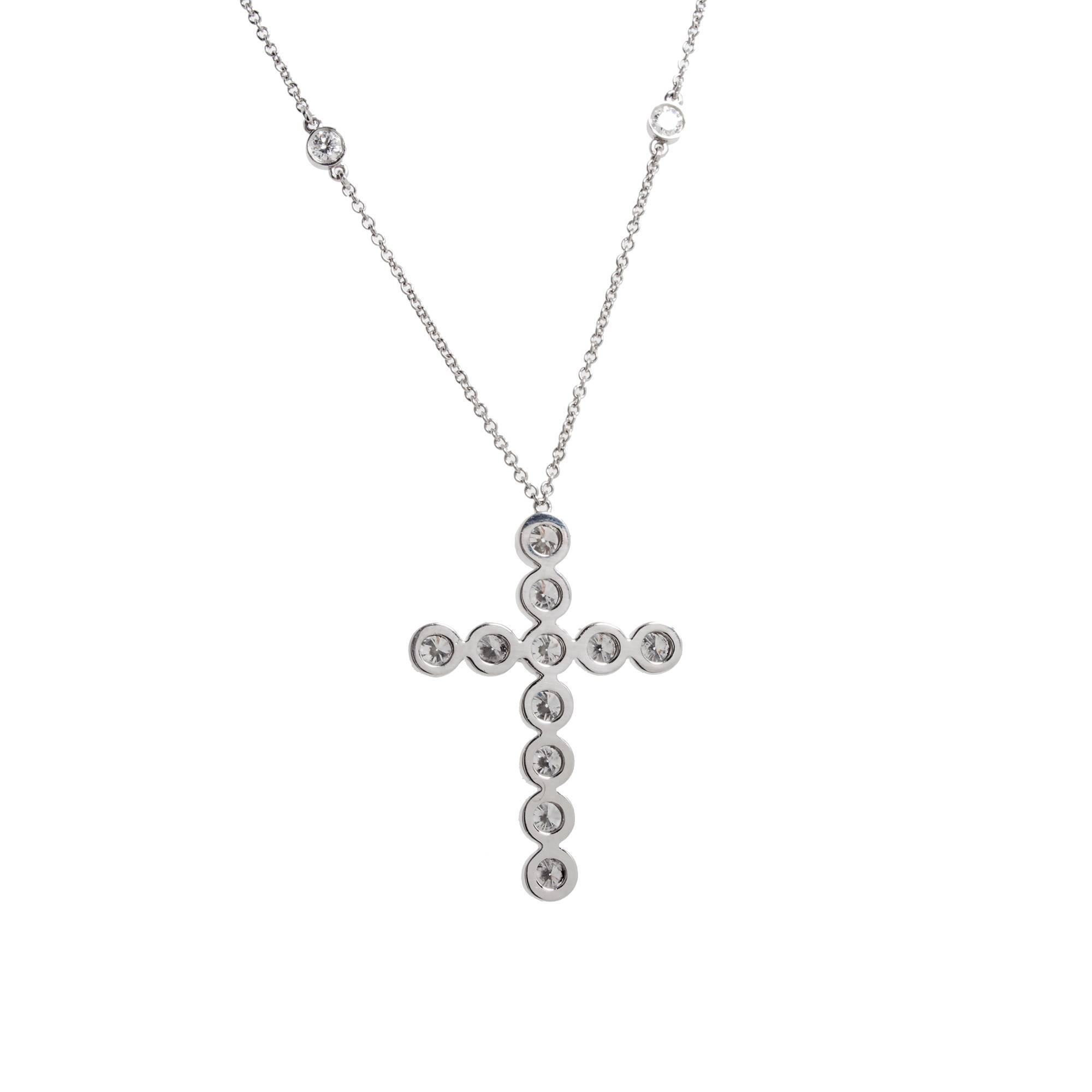 Authentic Tiffany & Co. Jazz Cross Diamond Pendant in Platinum

11 round diamonds F to G VS1 approx total weight 1.10cts
10 round diamonds F to G VS1 approx total weight .60 cts
Platinum
Stamped: Pt 950
Tested: Platinum
Hallmark: Tiffany &