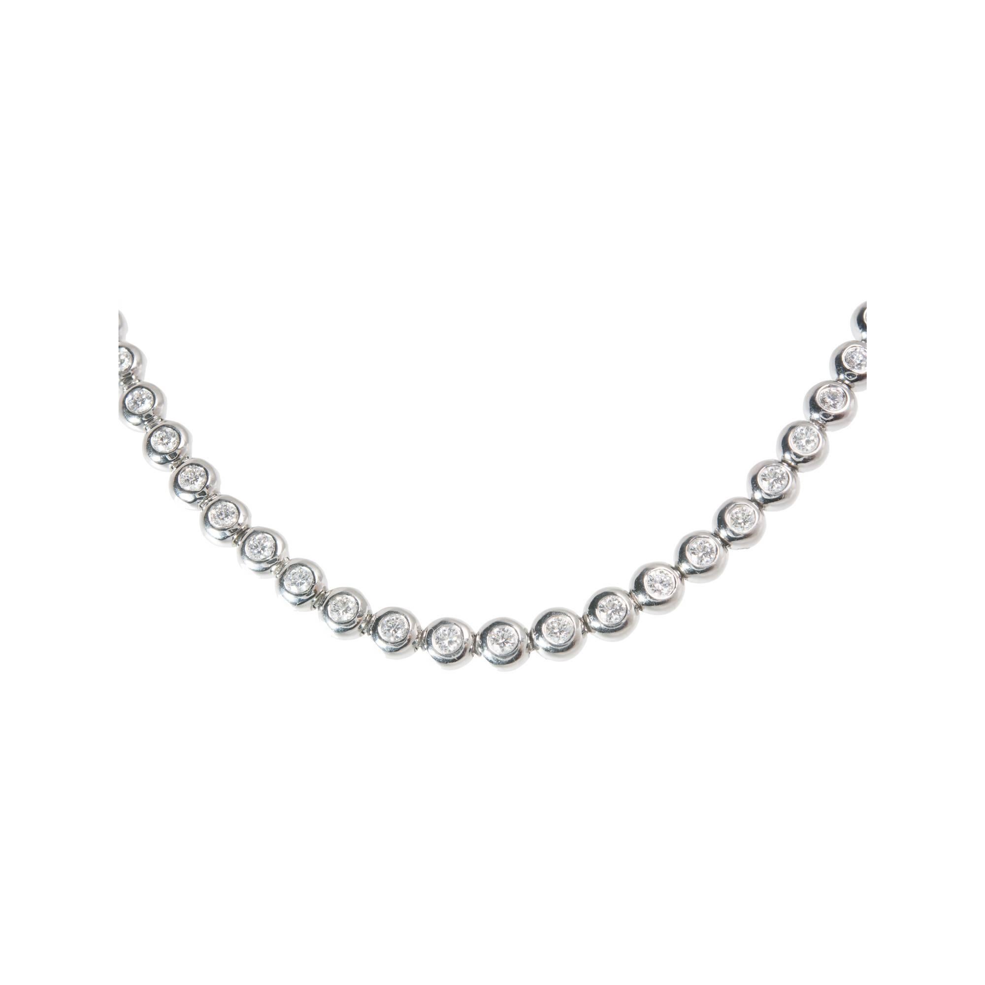 Tiffany & Co Platinum Diamond bezel set Tennis Necklace

82 round diamonds F VS approx. total weight 5.00cts
Total Length: 17.50 inches
58.2 Grams
Platinum
Stamped: Pt950
Tested: platinum
Hallmark: Tiffany & Co
Width: 5.16 mm
Thickness/ Depth: 3.15
