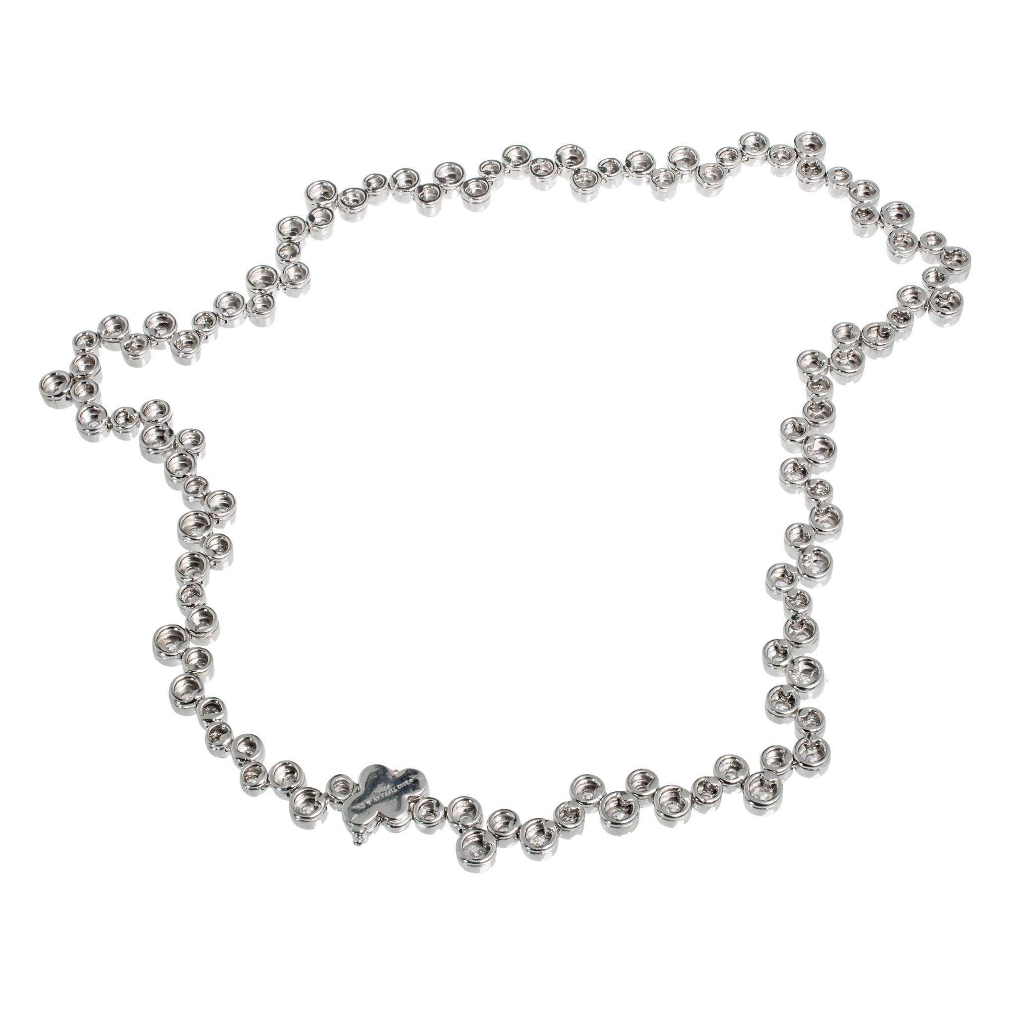 17 inch Tiffany & Co Bubbles Platinum Diamond Necklace

110 round diamonds F VS Approx total weight 8.40 cts
Platinum
Stamped: Pt950
Tested: Platinum
Hallmark: c 2002 Tiffany & Co
78.0 Grams
Total Length: 17 inch
Width: 8.18 mm
Thickness/