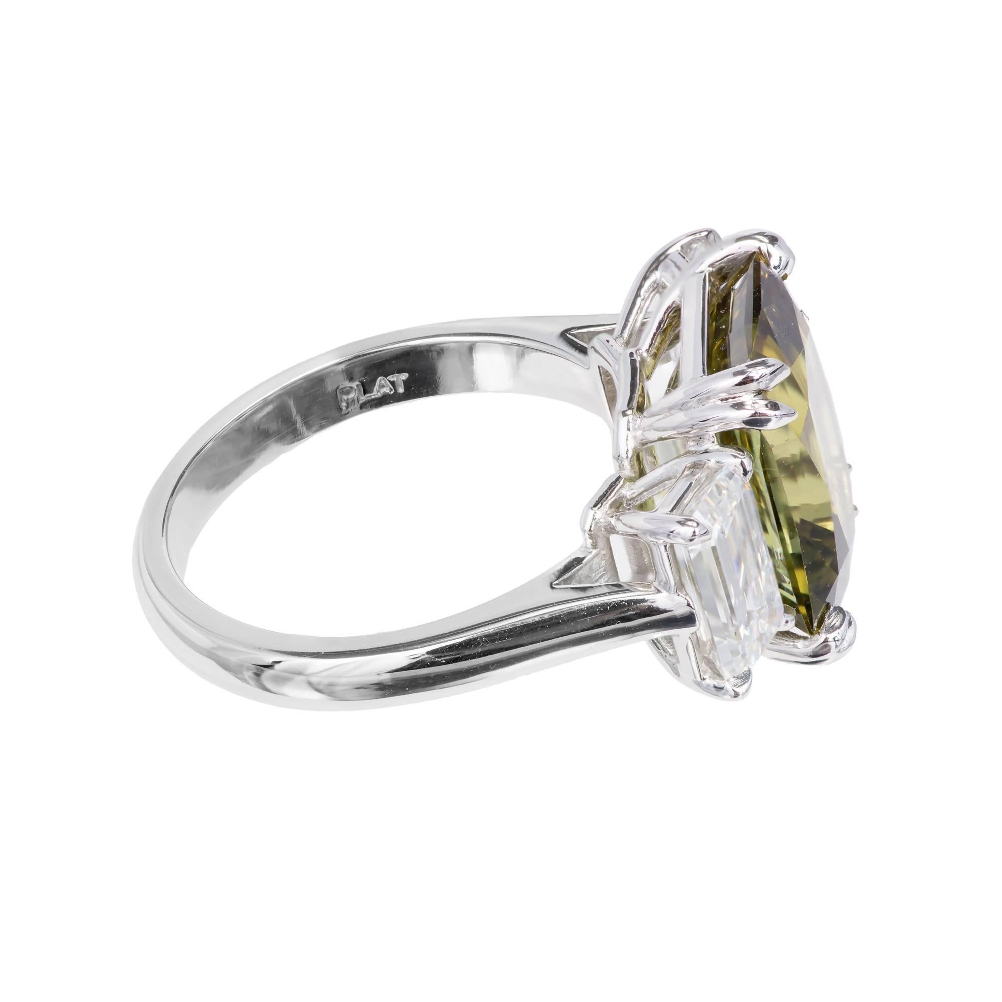 Peter Suchy emerald step-cut 7.68ct natural alexandrite engagement ring with D color emerald-cut diamonds. The stones are all GIA certified. The alexandrite has moderate to fair color change from yellow green to brown green. The setting is brand new