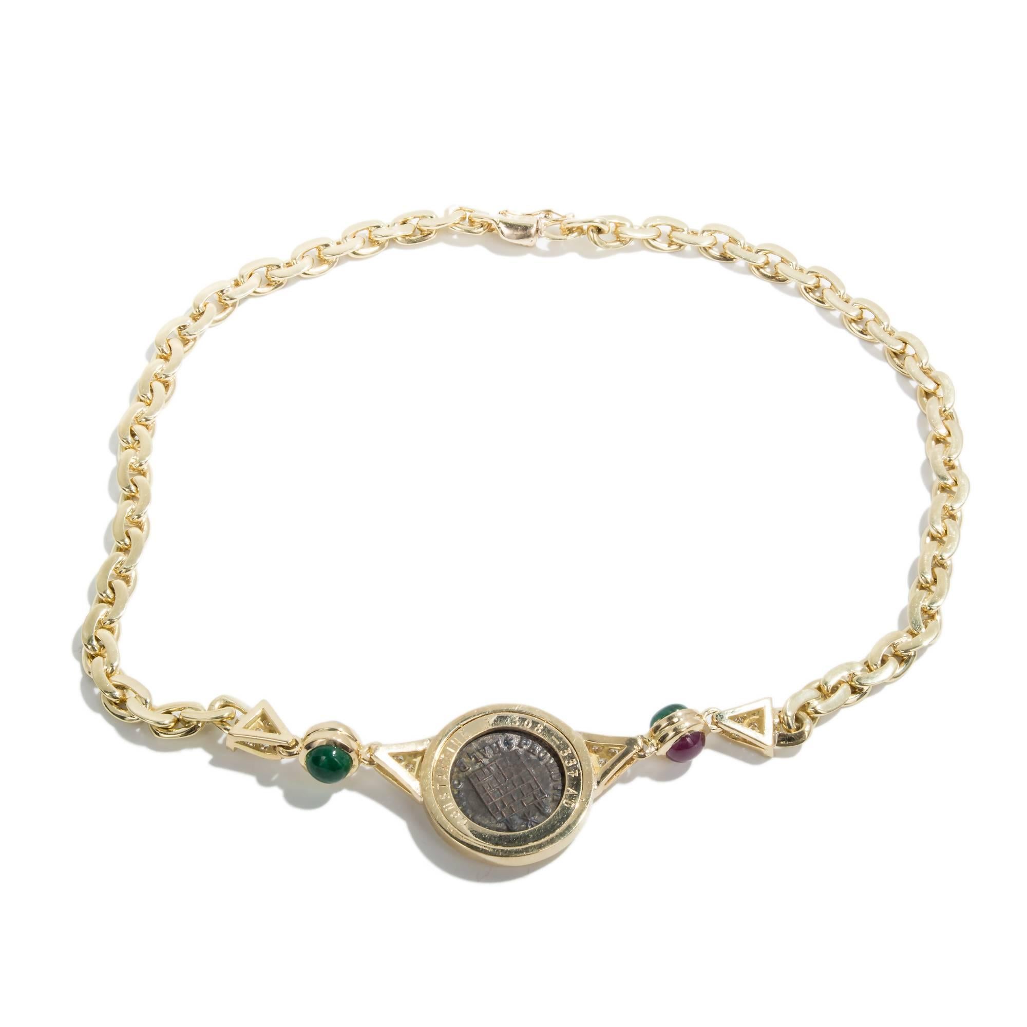 Ancient Roman Coin Necklace in 18k Yellow Gold with genuine cabochon emerald and ruby accents as well as diamond pave. 

24 round G VS diamonds .48cts approx. total weight: .48cts
1 Roman Coin
2 round cabochon rubies 6.5mm approx. total weight: