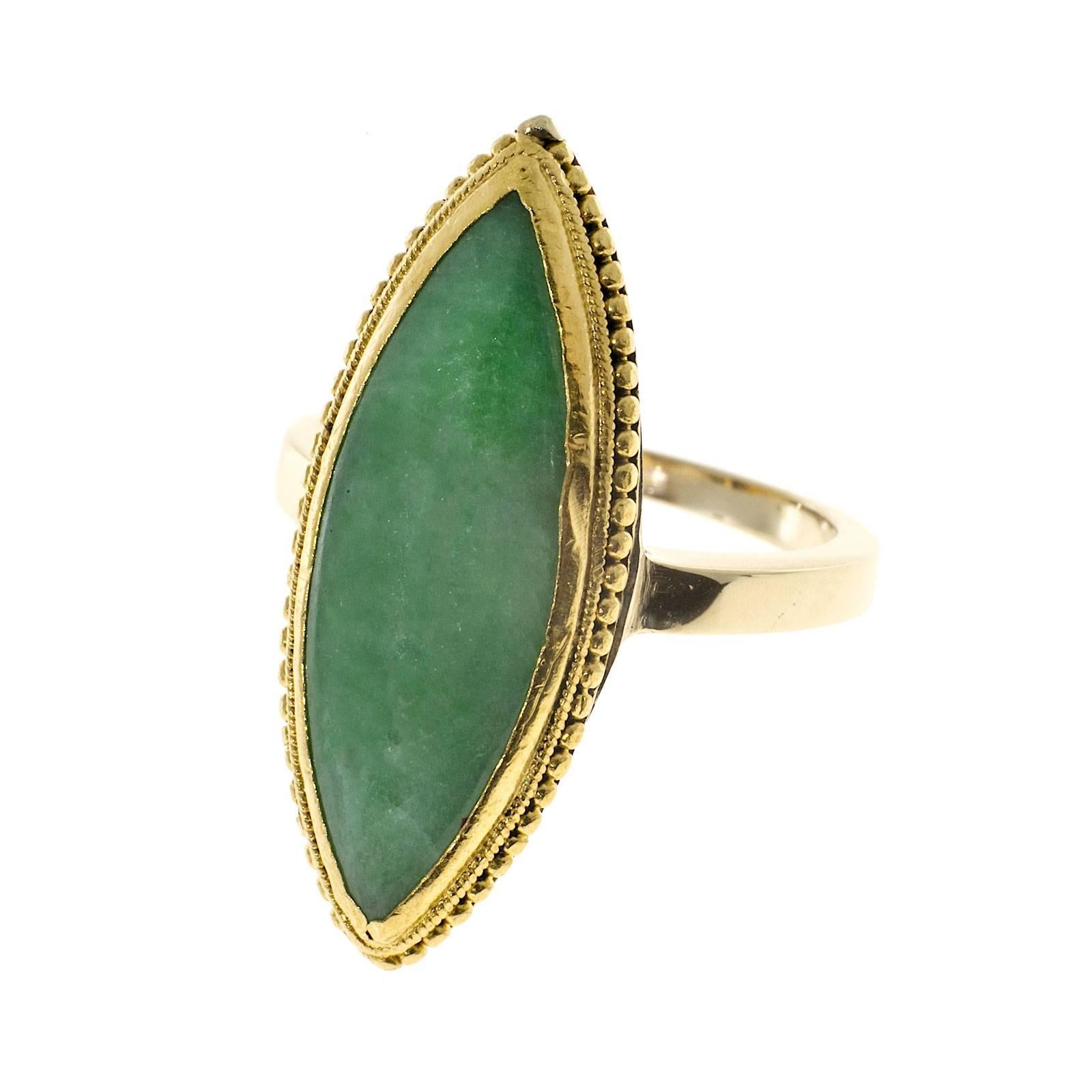 Well-polished GIA certified Jadeite Jade 24.83mm long 24k yellow gold ring with hallmarks under the stone. 

1 Marquise translucent mottled green Jadeite Jade, 24.83 x 8.54mm, GIA certified Jadeite Jade natural no enhancements
24k yellow