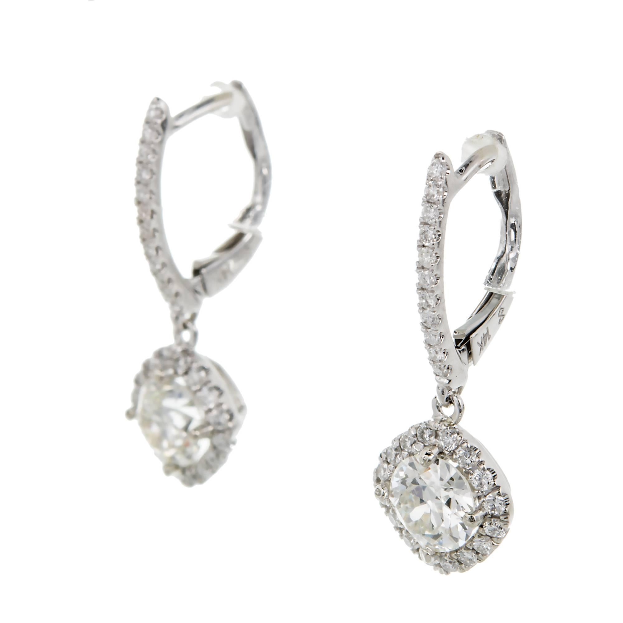 Peter Suchy cushion halo dangle 14kt white gold dangle earrings old European cut sparkly center Diamonds surrounded by bright full cut Diamonds.

2 old European cut Diamonds, approx. total weight 1.02cts, I, SI1
54 round full cut Diamonds, approx.