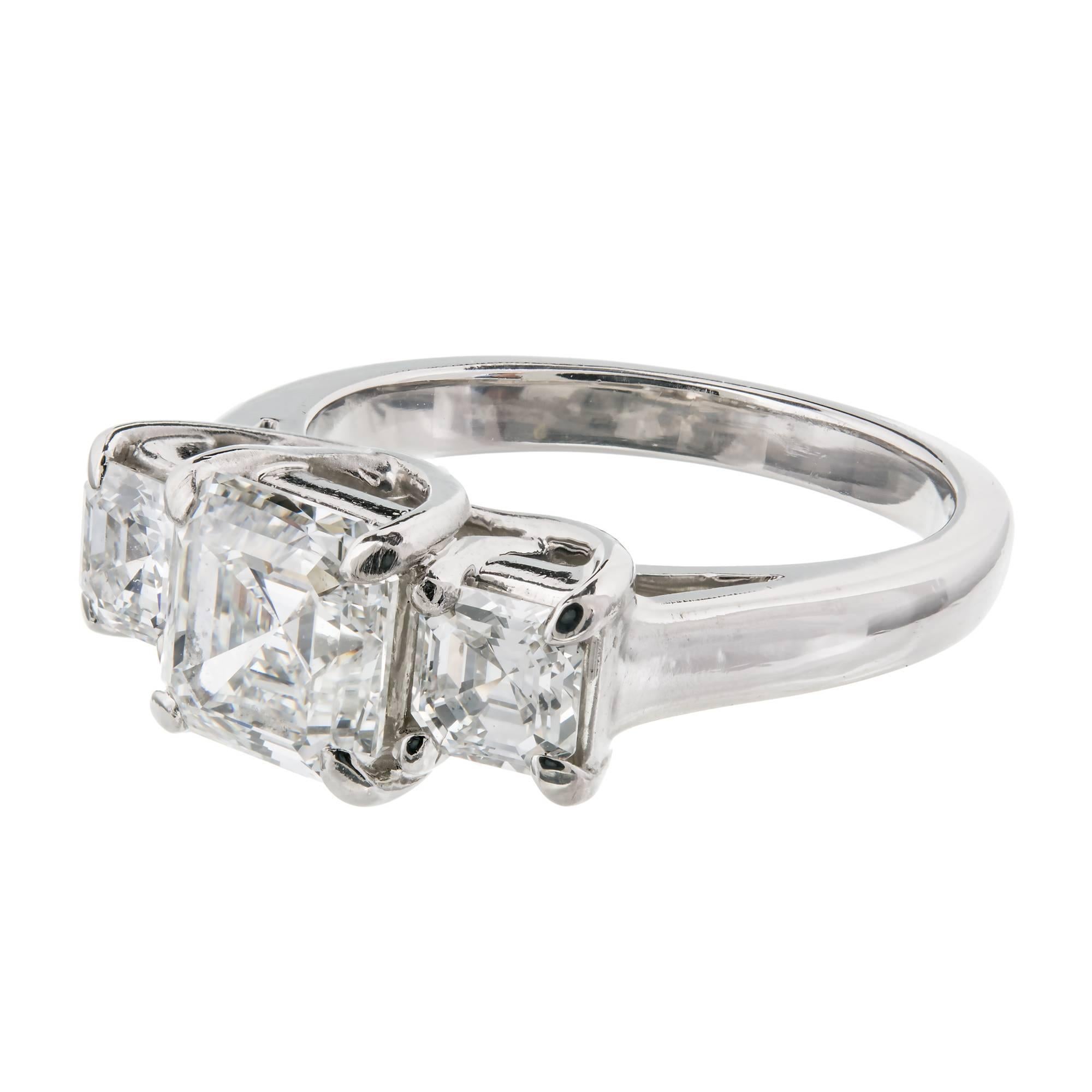 Hammerman Brothers custom-made Lucida style 3 stone Asscher cut Diamond engagement ring. Triple crossed prongs. All Diamonds have a very bright cut and lots of sparkle. The center Diamond is GIA certified 1.84cts, F color and VVS1 clarity. 

1