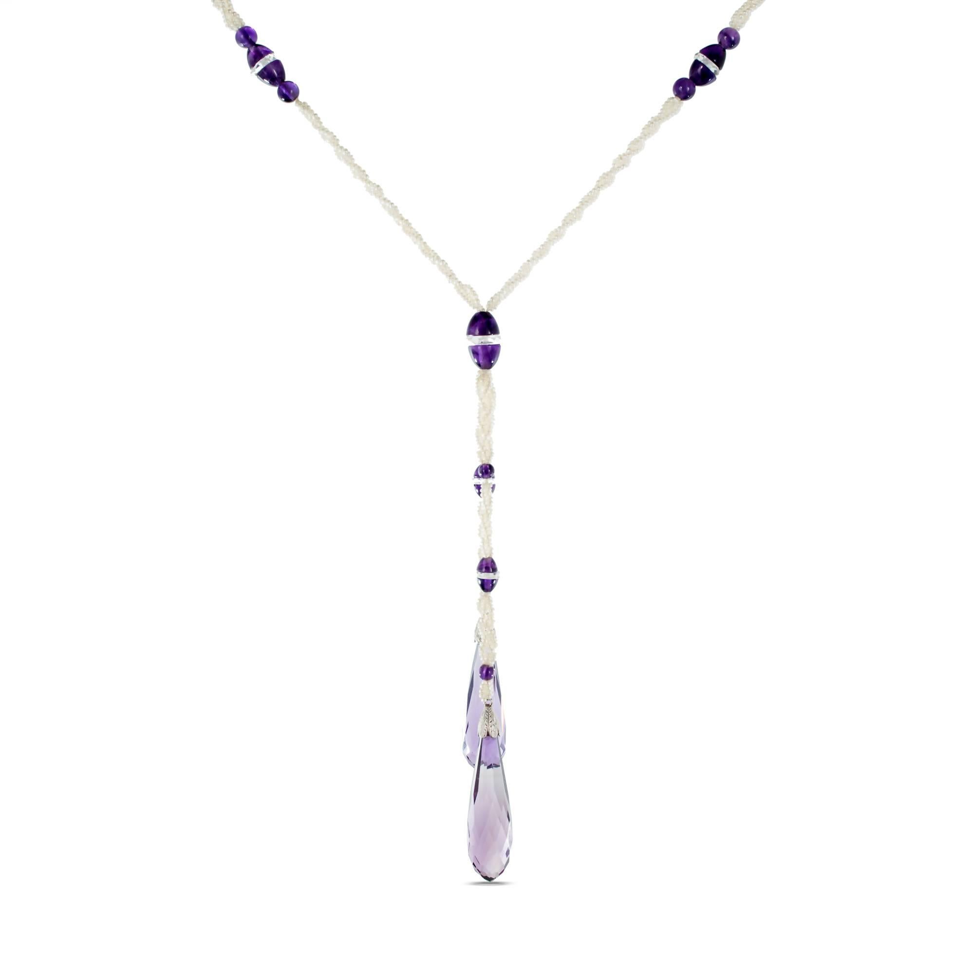 Long hand knotted natural seed pearl and natural Amethyst drop necklace. We estimate there are 2,500 natural pearls in the necklace. The range from 1.15 - 1.52mm. The GIA certifies the pearls as Pinctada species natural salt water pearls, no