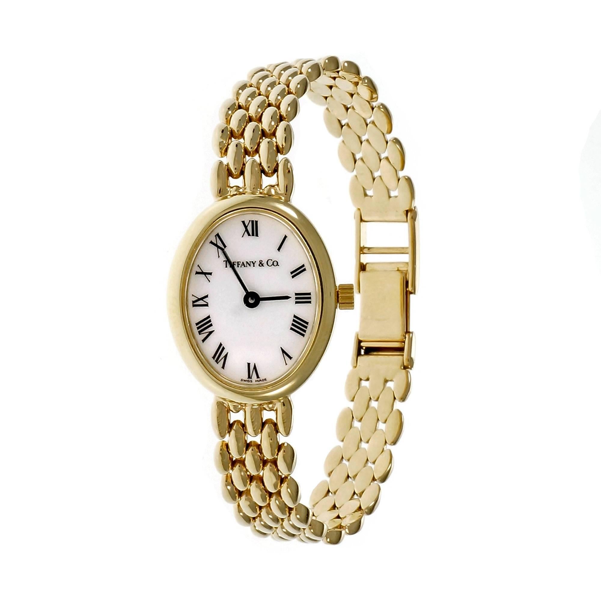 Oval Tiffany & Co 14k gold ladies wrist watch with five row Panther link bracelet. Reliable Quartz movement.

14k yellow gold
26.5 grams
Bracelet length: 7.25 inches
Length: 24mm
Width:19.5
Band width at case: 9mm
Case thickness: 5.45mm
Band: