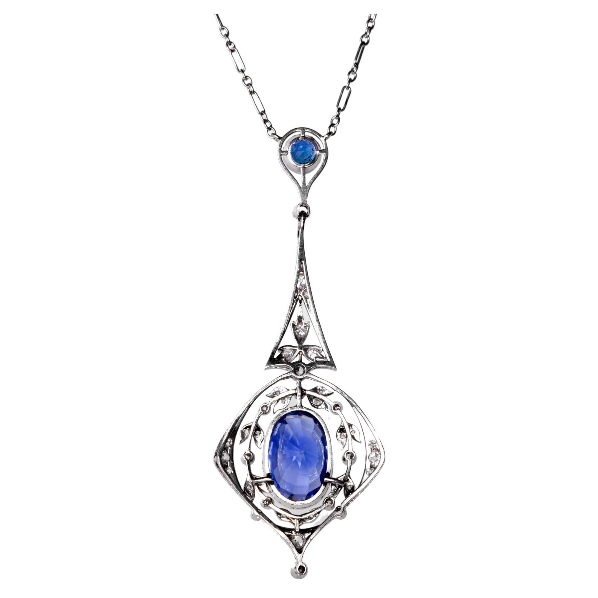 Periwinkle Bright Blue Sapphire and diamond platinum necklace pendant. AGL certified Natural No Heat Ceylon (Sri Lanka) Origin. The main sapphire is a purple periwinkle blue in an open work platinum setting surround by sparkly diamonds. The chain is