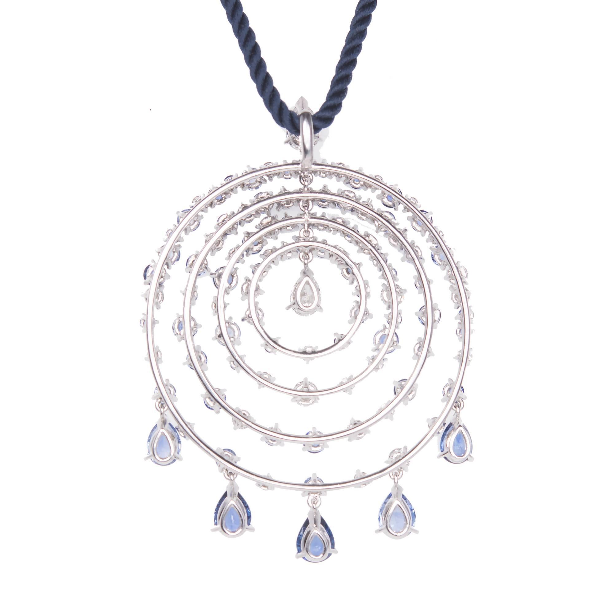 Van Cleef & Arpels Petillante 18k White Gold pear and round sapphire and diamond necklace pendant. Comes with a 15 inch long navy blue twisted silk  2mm necklace with an 18k catch. 

5 Pear shaped gem blue sapphires VS approximately 2.00