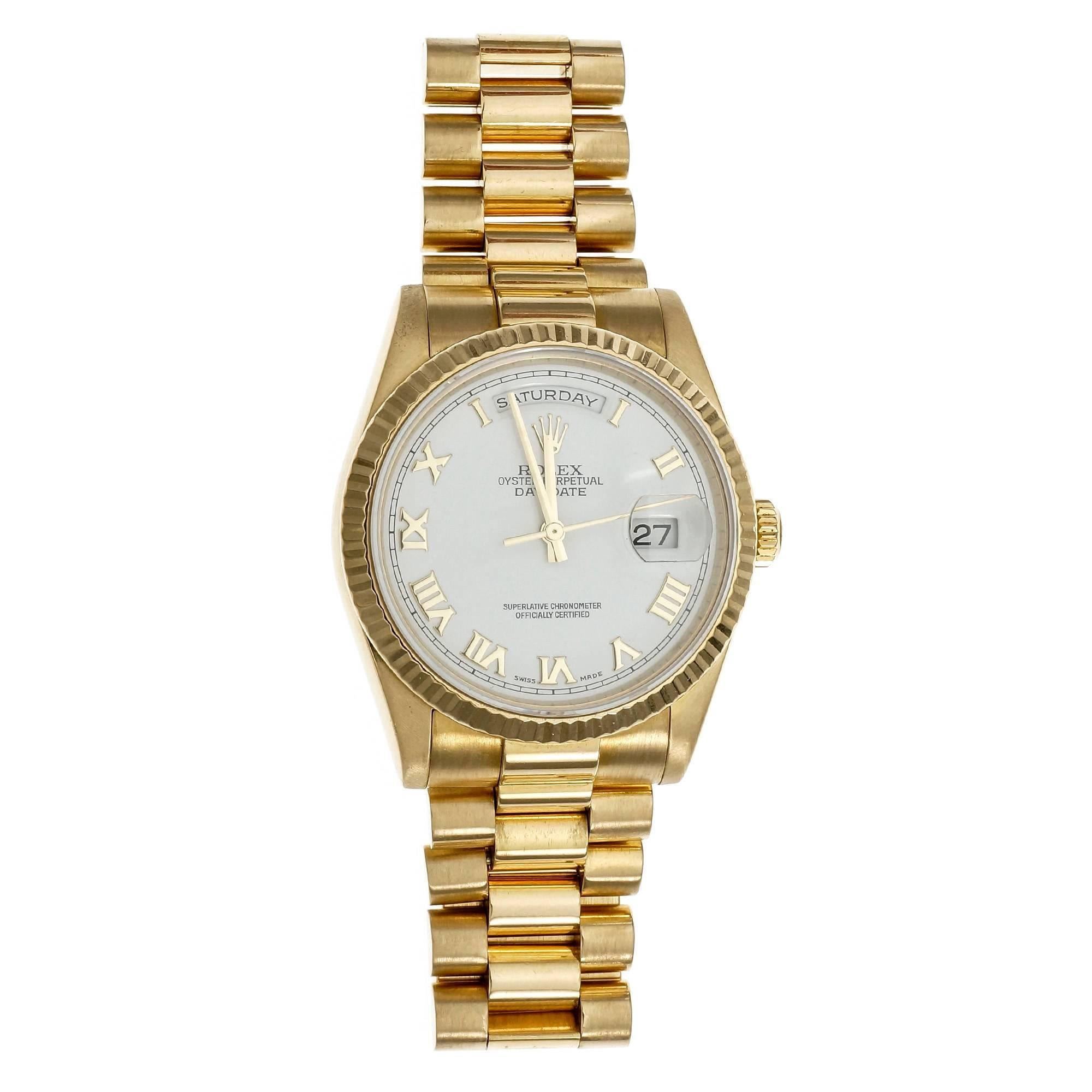 Rolex President Oyster Perpetual day date solid 18k yellow gold wrist watch circa 2003 to 2004. Roman numeral dial. 
 
18k yellow gold
Band length: 7.25 inches – can be shortened of lengthened
Length: 43mm
Width: 36mm
Band width at case: 20mm
Case