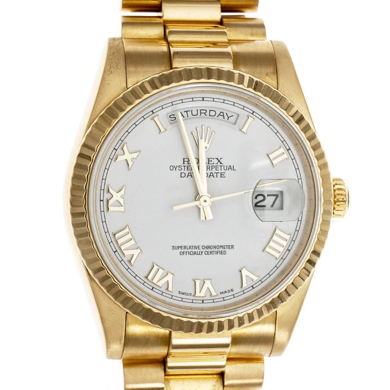 gold rolex white face