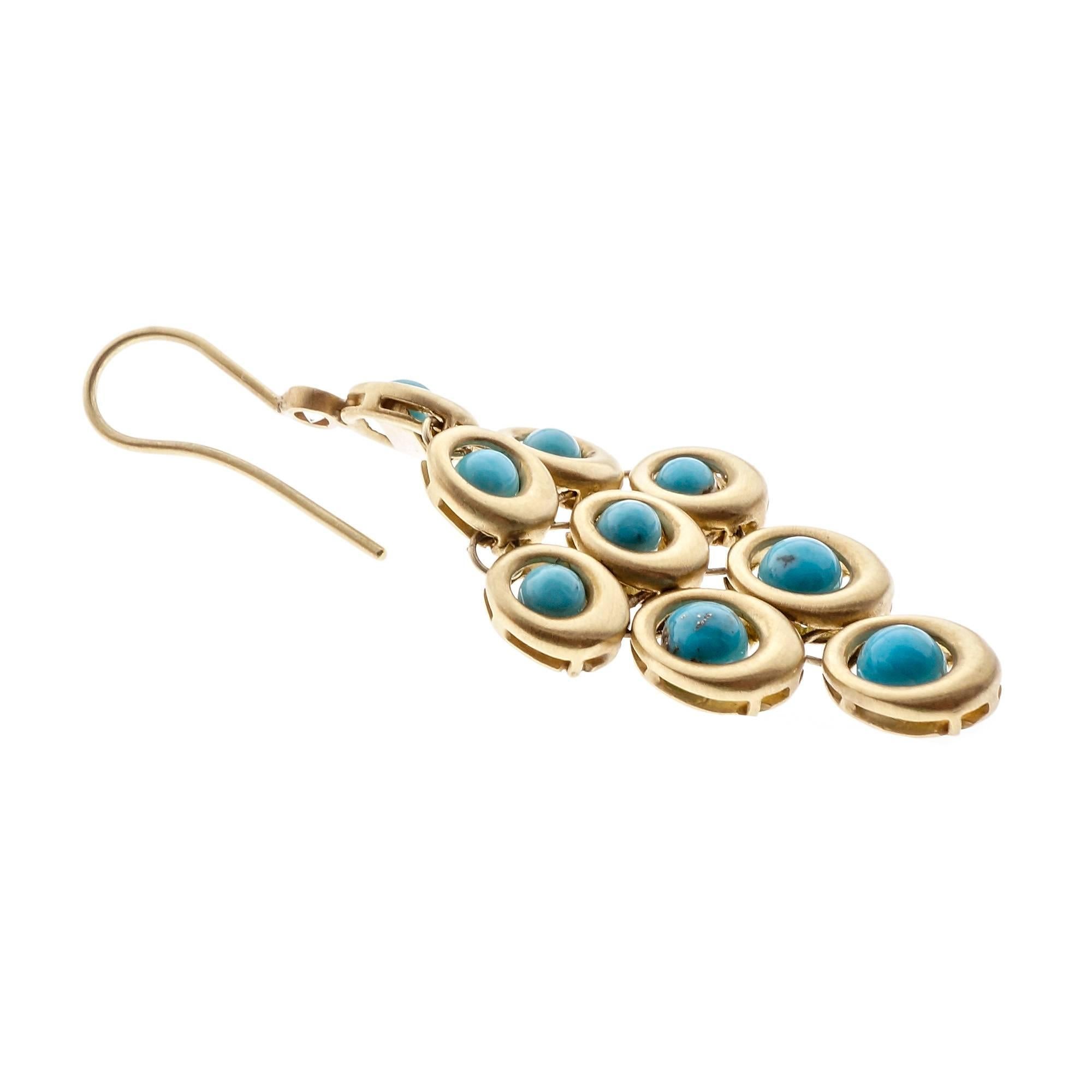 1970’s 18k yellow gold dull finish dangle earrings with GIA certified natural Turquoise in hinged flexible settings with sparkly Diamond accents. Polymer infused for lustré. This was often done to natural Turquoise in the 1970’s. 

18 round natural
